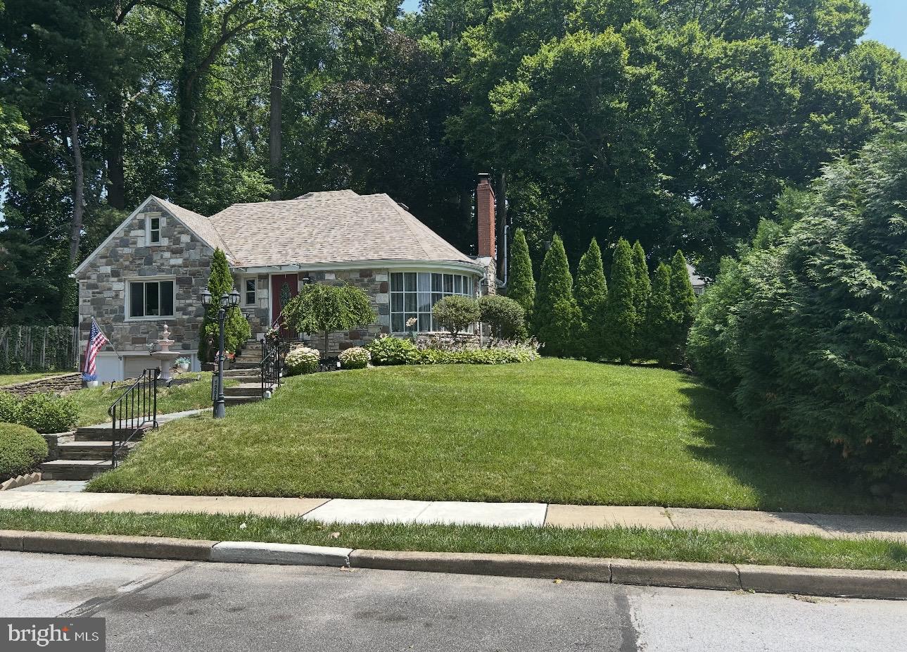 Welcome to this exceptional custom stone and stucco two-story home tucked away on a private cul-de-sac in the highly desirable Aronimink community of Upper Darby Township. Lovingly maintained by only its second owners, this home offers timeless charm, thoughtful updates, and an ideal layout for both everyday living and entertaining. Step inside to find a welcoming dining room filled with natural light from two large casement windows. The updated kitchen features a gas cooktop/oven, dishwasher, microwave, refrigerator and abundant workspace for the home chef. The main level also offers a spacious primary bedroom with his-and-hers closets and abundant natural light, a second bedroom or home office with built in cabinets, a full bath, a convenient powder room and the option for 1st FL laundry.  Step down  and be impressed by the expansive living room with gleaming hardwood floors, a stunning stone fireplace, and a beautiful curved picture window. Adjacent is a spectacular California room featuring Berber carpeting and a wall of windows that flood the space with natural light. A screened porch spans the entire width of the home offering peaceful views of the deep, private backyard. The second floor offers two additional bedrooms with hardwood flooring, an updated full bath, generous closet space, and easy walk in access to a large floored attic providing exceptional storage.The single car, built in garage opens into an expansive full basement that can easily serve your work, lifestyle or storage needs. Additional highlights include central air conditioning, 200-amp electric service, an updated roof, water heater, furnace and one of two AC systems. Ideally located with easy access to major commuter routes, shopping, dining, and more, this impressive home truly has the "wow" factor. Don't miss your opportunity to make it yours while there's still time to enjoy hosting family and friends for summer barbecues in your beautiful back yard! Open House Saturday, July 11, 2026, from 1:00–3:00 PM.