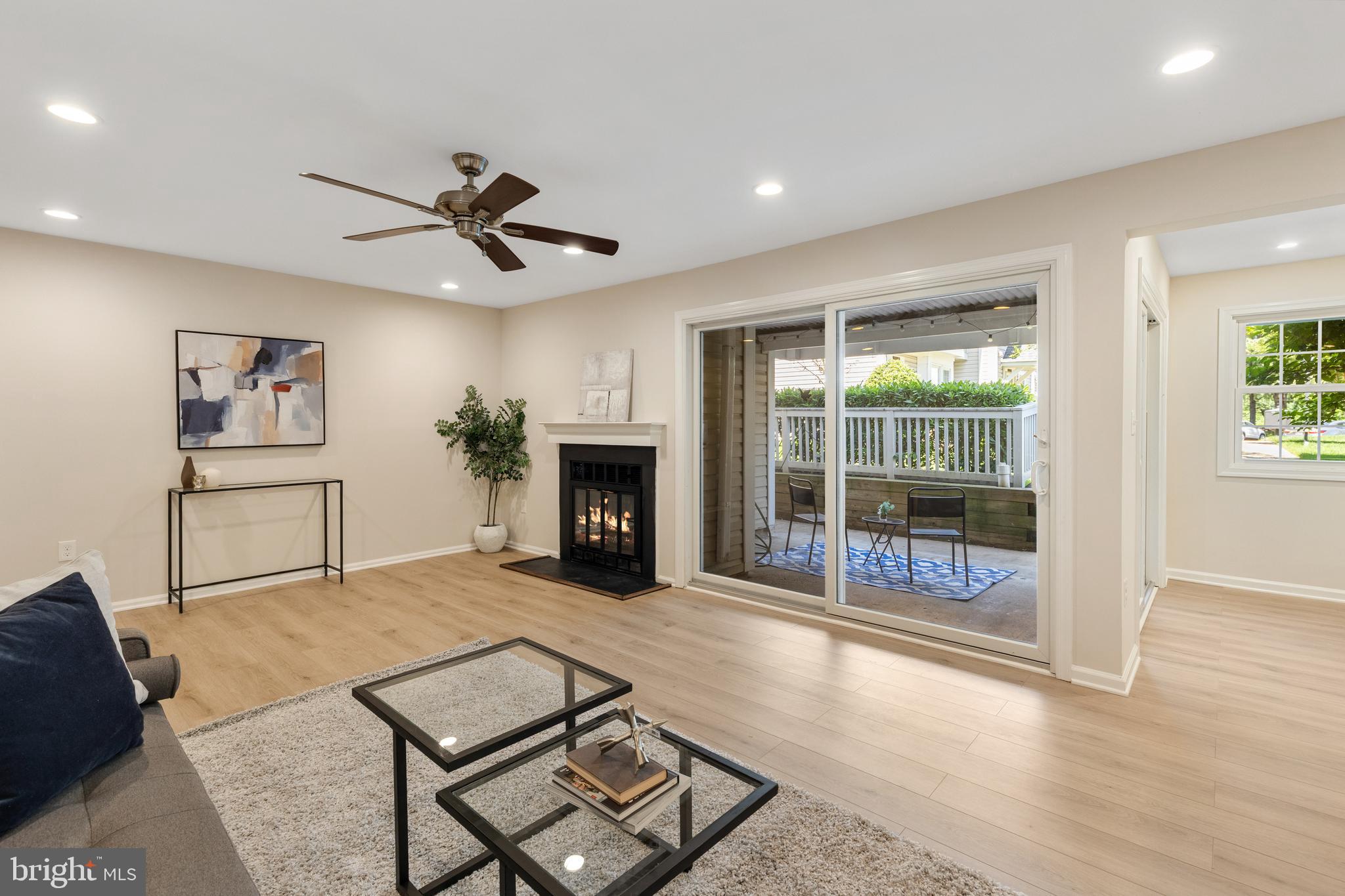 ASSUMABLE LOAN at 2.875%! Please reach out to the listing agent for additional information. Beautiful 2-bedroom, 1.5-bathroom home nestled in the highly sought-after Heatherlea community! This truly one-of-a-kind Fairfax model offers a rare, reimagined layout unlike any other in the neighborhood, combining stylish updates, exceptional functionality, & an unbeatable location just moments from Shirlington. Freshly painted throughout & featuring NEW luxury vinyl plank flooring, this inviting residence is move-in ready and filled with thoughtful enhancements.

The welcoming entry features both a utility closet & a large coat closet outfitted with custom ELFA shelving for exceptional organization & storage. The spacious living room showcases durable NEW LVP flooring, recessed lighting, a cozy wood-burning fireplace, & a large sliding glass door that opens to the covered patio. The convenient & unique private patio features a gate with direct access to the expansive green space behind the home. The adjacent dining area is accented by recessed lighting, a ceiling fan with overhead lighting, & sliding glass door patio access, making it perfect for everyday living or entertaining guests. The updated kitchen features eye-catching soft-close red cabinetry, granite countertops, stainless steel appliances, & a breakfast bar with space for stool seating. A conveniently located laundry closet with stacked washer & dryer sits just off the kitchen.

Down the back hallway, you'll find the spacious primary suite featuring plush carpeting, a ceiling fan with overhead lighting, a walk-in closet with custom ELFA shelving, & an ensuite bathroom with a vanity, medicine cabinet mirror, & a beautifully tiled walk-in shower complete with a built-in bench, niche shelving, & pebble tile flooring. The generous secondary bedroom offers NEW LVP flooring, a ceiling fan with overhead lighting, & a large closet with custom ELFA shelving. An added half bathroom accented with a vanity, medicine cabinet mirror, & shared access to the primary bathroom's shower completes this lovely home.

Additional highlights include two reserved parking spaces, abundant visitor parking, access to the community pool, & beautifully maintained common grounds. Ideally located just a short walk from the shops, restaurants, & entertainment of The Village at Shirlington, this home also offers easy access to I-395, West Alex, Bailey's Crossroads, Del Ray, Old Town, & DC.