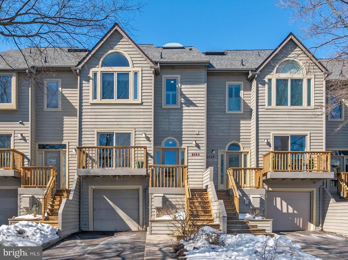 Open House Saturday, April 18th . No public signage permitted - please contact listing agent for details.  This marina-front townhome offers beautiful views of the Chesapeake Harbour marina and the Chesapeake Bay, with an open, light-filled floor plan that embraces the waterfront setting. Sunlight fills the main level, where refinished hardwood floors and open living and dining spaces create a natural gathering place for both relaxed everyday living and entertaining. The kitchen has been enhanced with a center island with a Quartz countertop that adds both function and casual seating, along with a new refrigerator. Removal of the knee wall between the dining and living rooms allows the space to feel more connected and open. Hardwood flooring continues up the stairs and throughout the upper hallway and primary suite, while custom glass stair panels add a clean, modern architectural element that enhances the home’s sense of openness. Brand new carpet on the stairs to the lower level adds comfort and warmth. The primary suite offers a calm and comfortable retreat, complemented by a shiplap accent wall and thoughtful finishes. The loft level is currently designed as a custom walk-in closet and dressing room with built-ins, providing exceptional storage while easily adaptable as a bedroom, home office, or private space. Life in Chesapeake Harbour offers a truly special waterfront lifestyle, with 24-hour gated security, two outdoor pools, tennis courts, a sandy beach, scenic walking and jogging paths, an on-site marina, and waterfront dining. Whether enjoying quiet mornings by the water or the convenience of being just minutes from downtown Annapolis, this home offers the ease and beauty of marina-front living in one of Annapolis’ most desirable gated communities.