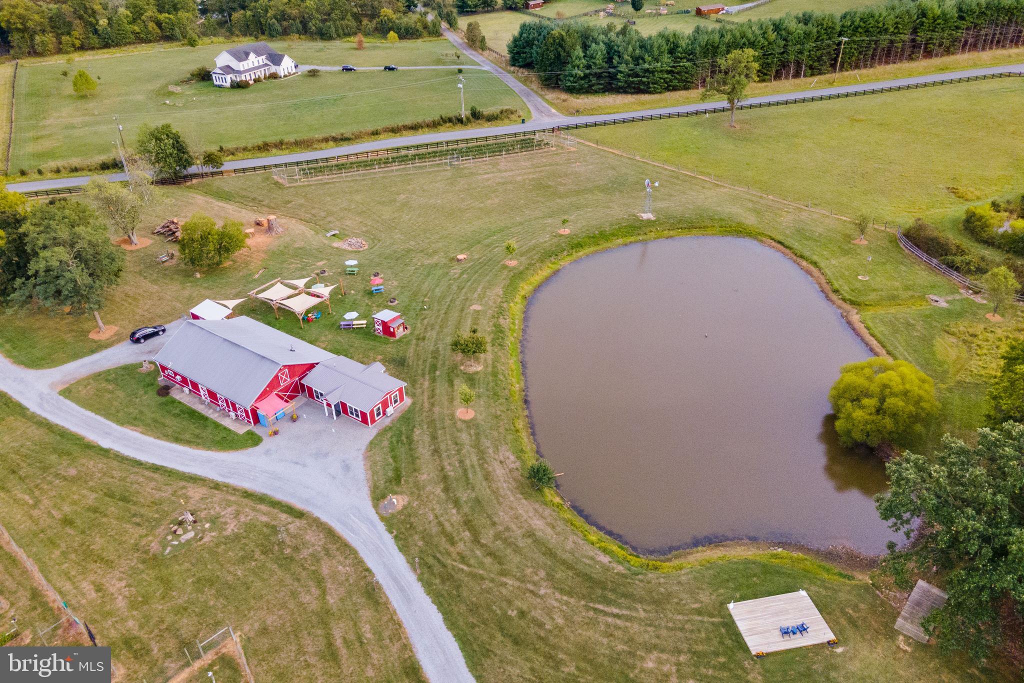 A dream come true! Make this little slice of paradise your new reality. Presenting an unbelievable opportunity to own a thriving, turn-key boutique farm winery in Loudoun County. The property consists of 11.52 acres with  1.7 acres under vine. The winery boasts award-winning wines, a cozy tasting room, and a production facility cleverly located in a masterfully restored barn. The winery has several exterior areas for gathering and entertainment, including an outside bar and picnic areas with stunning views of the pond and Short Hill Mountain. 

Some property highlights include: gorgeous aerated pond with deck; extensive electric fence for dogs; deer fence surrounding the vineyard blocks; lovingly built winery tasting room with tasting bar and seating; production facility currently processing and aging   350 cases of wine annually; band stage, and much more.

Life on the farm gets even better with an estate house perfect for the future owner to enjoy modern country living, or to create additional revenue as an Airbnb or Bed & Breakfast. The list of upgrades for this 2016 custom-built home are too numerous to list, but some highlights include: main-level primary bedroom suite with access to two bathrooms; 2-3 upstairs bedrooms with Jack-and-Jill bathroom and walk-in closets; a library loft with Murphy bed; a chef's kitchen with dual-fuel La Cornue stove; wine cellar; PEX plumbing system; 2200+ SF of extra-wide wraparound porch with a large screened-in section; 1000-gallon propane tank that supports a state-of-the-art generator; high-end dual-zone HVAC, and metal roof. 

The sales price is inclusive of winery furniture and fixtures, farm equipment, production equipment, wine inventory, and business goodwill. This is the perfect opportunity for the small or novice wine producer to make their mark in the thriving Loudoun County wine industry.

Showings of the winery buildings must be coordinated with listing agents and are BY APPOINTMENT ONLY with listing agents and/or owner present. Please call with questions.

The property is in Open Space use. Sellers are not responsible for rollback taxes.