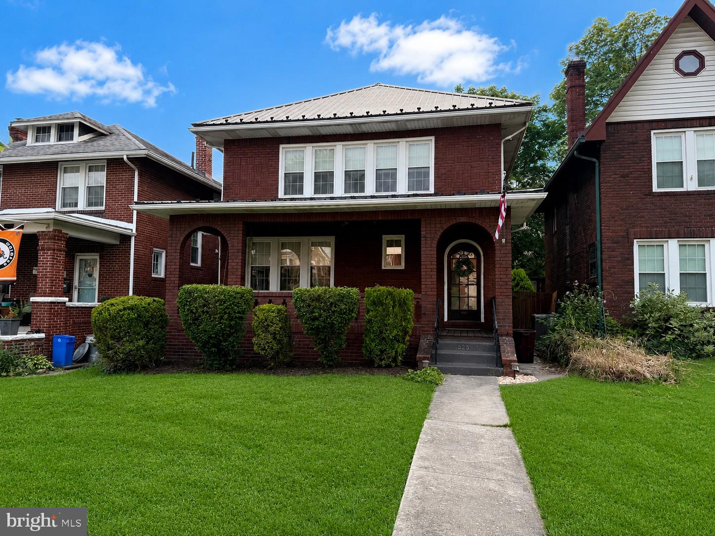 Fall in love the moment you arrive! This storybook brick two-story in the coveted Johnson Heights neighborhood is overflowing with charm, character, and the kind of warmth that instantly feels like home. From the gorgeous curb appeal and welcoming front porch to the beautifully updated interior, every detail invites you to slow down and stay awhile. Rich hardwood floors flow throughout the home, while the updated kitchen and stylish bathrooms blend modern convenience with timeless appeal. On chilly mornings, you'll appreciate the luxurious heated floors in the kitchen and half bath, and on cozy evenings, the gas fireplace creates the perfect gathering space. Thoughtfully maintained with replacement windows, a durable metal roof, gas hot water heat, and central air, this home offers comfort and peace of mind in every season. Step outside to discover a level, fully fenced backyard designed for entertaining and everyday enjoyment, complete with a stunning rear paver patio, detached garage, and plenty of off-street parking. Whether you're hosting summer cookouts, sipping coffee on the expansive front porch, or enjoying a quiet evening under the stars, this home delivers the lifestyle you've been dreaming of. Beautifully updated while preserving its classic character, this exceptional 3-bedroom, 1.5-bath home is more than just a place to live—it's a place to create memories. Opportunities like this in Johnson Heights don't come around often, so schedule your private tour before someone else calls it home!