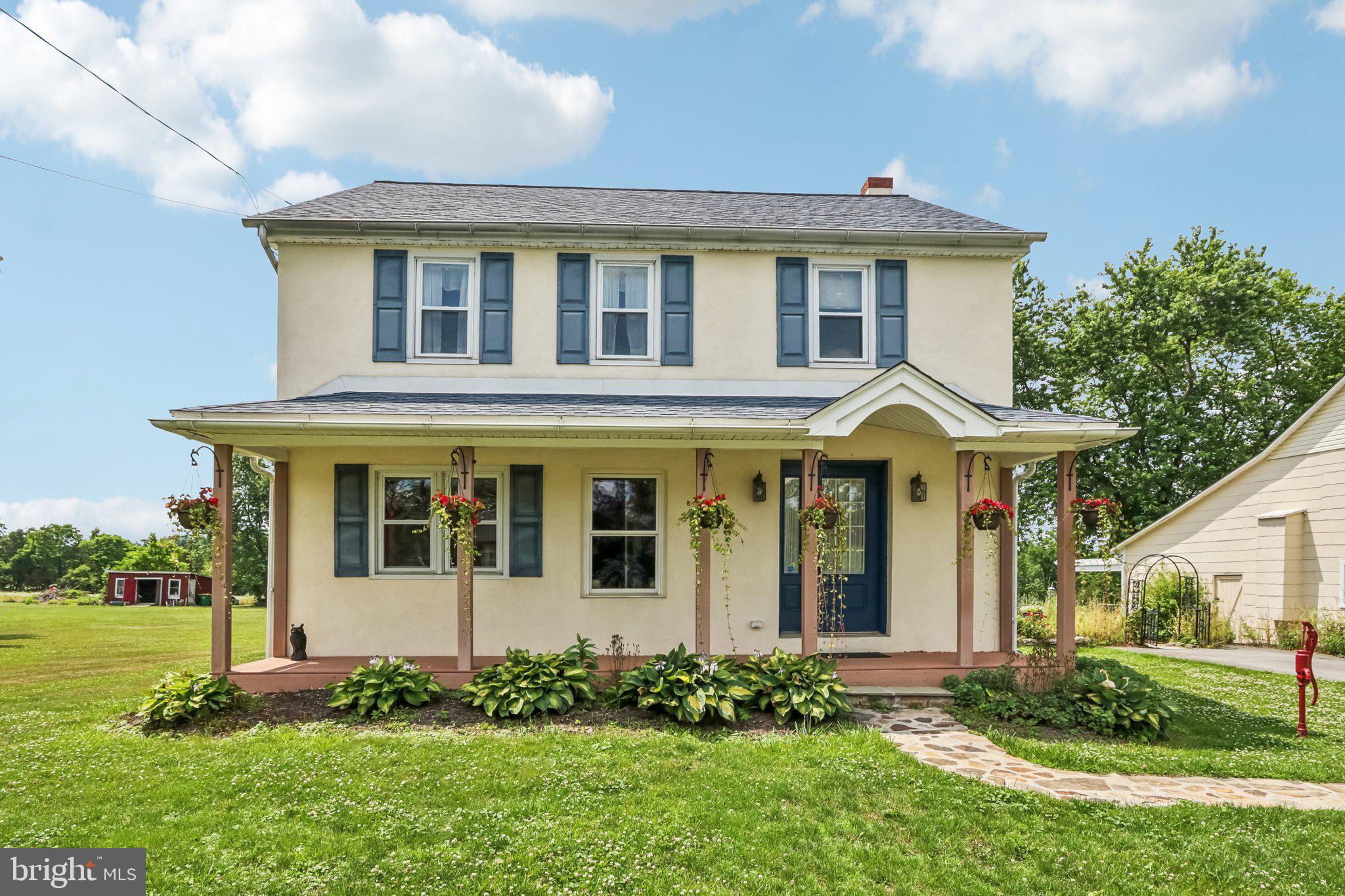 Welcome to this storybook setting and restored, renovated and expanded farmhouse. Wonderful appointments throughout the home include hardwood flooring, stone wall, large rooms and fantastic outside venues for dining, relaxing and entertaining. From the enchanting covered front porch the floor plan offers direct access to the living room with hardwood floors and open stairway or library/study previously used for in-home business. The family room is an exceptional highlight with a solid wall of exposed stone, fireplace and beautiful engineered hardwood floors. In the rear half of the expansive floor plan is additional room great for a private office, wonderful gathering kitchen with breakfast area. Abundant cabinets, huge island, appliances include gas range, refrigerator and dishwasher. Incredible addition accommodating the first floor primary suite with beautiful bath boasting granite countertop and standup shower area, wonderful size bedroom with direct access to private deck area overlooking backyard. The second floor provides 3 additional bedrooms and full bath and there's walk up access to large attic area. The basement is clean and dry previously used for hobbies and projects. Updated heating equipment, hot water heating and water treatment system. All systems up to date, replacement windows, propane tank and well cared for structure. Ever impressive this home offers outside areas the include terraces, patios, fish pond and a large outbuilding offering additional 2700+ sq ft of barn space for entertaining, animals, gardening, garage parking or anything you care to use it for.