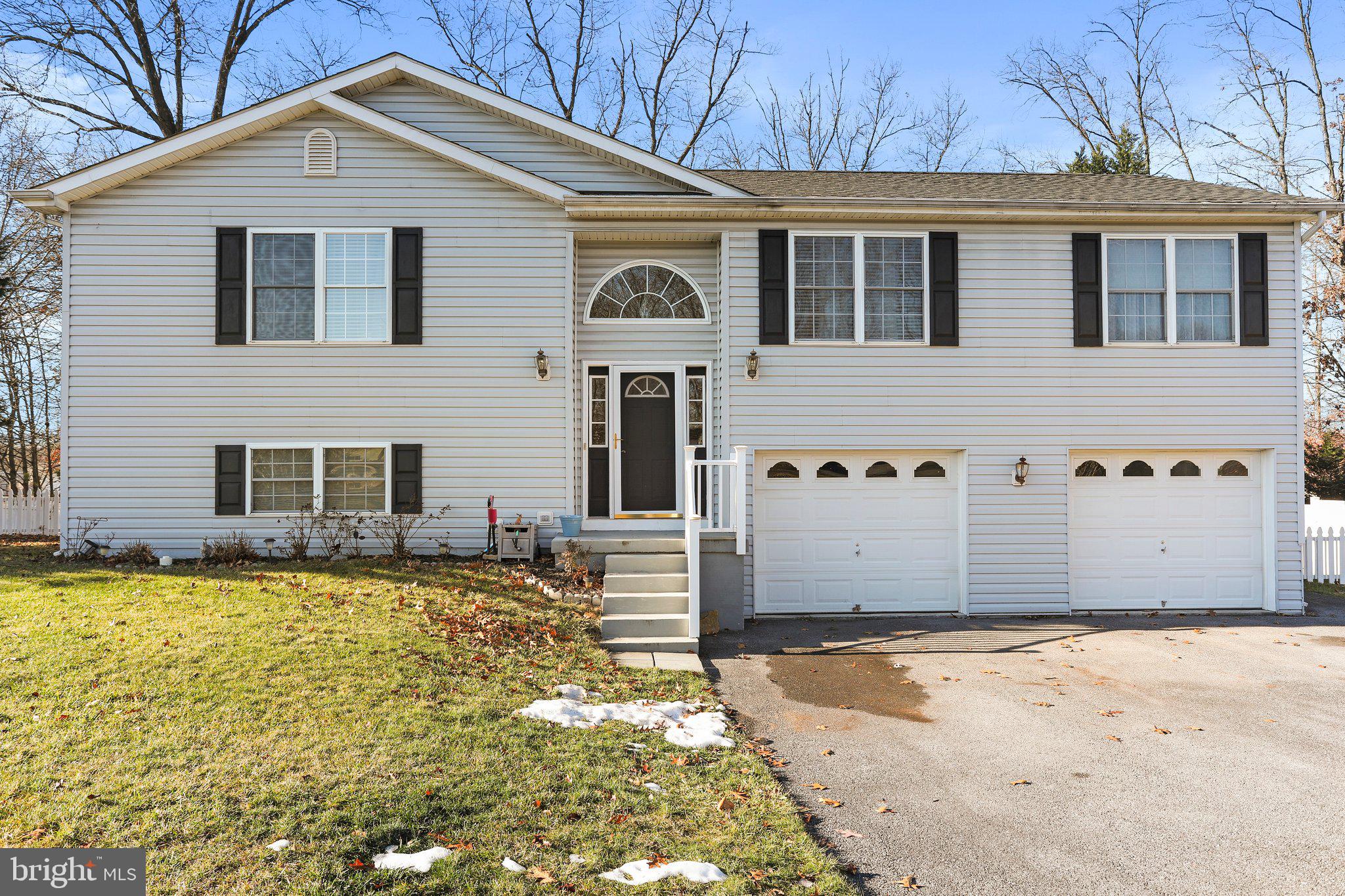 Explore the charm of this move-in-ready 3 bed, 2.5  home. This house offers a serene backyard, an enclosed sunroom, and a spacious lower patio. Open floor plan with new flooring. The kitchen boasts ample cabinet and counter space. Full finished lower level with walk out. Oversized garage with storage and work area. Don't miss out on this beautiful property!  Professional photos to come!