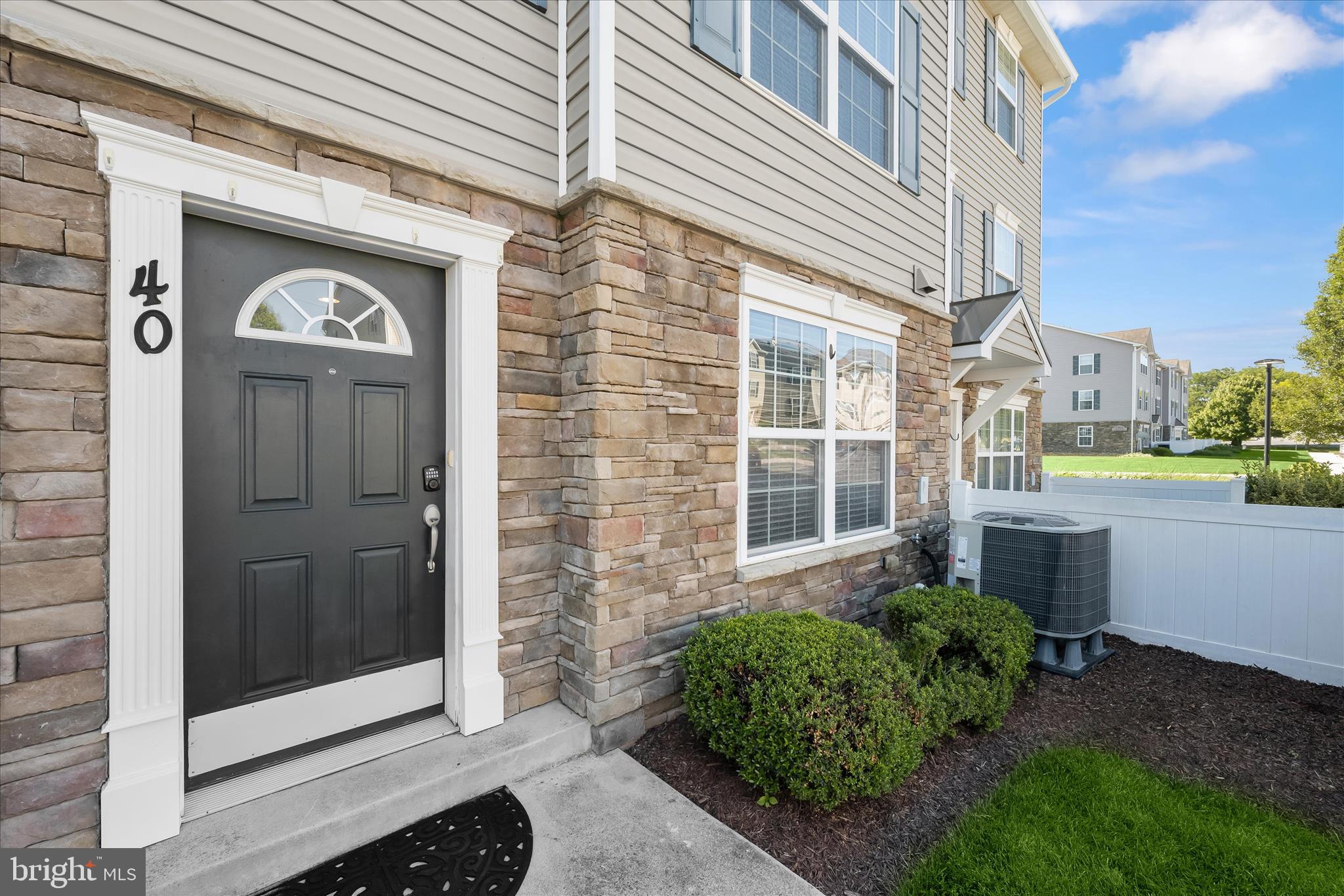 Welcome home to this beautifully appointed three-level townhome in Reservoir Ridge, one of Eldersburg's most desirable communities, where stylish interiors, generous living spaces, and resort-style amenities come together to create an exceptional lifestyle. Step inside and you'll immediately appreciate the bright, open-concept main level designed for both everyday living and effortless entertaining. Sunlight pours through the windows, highlighting the warm luxury vinyl plank flooring, recessed lighting, and inviting living and dining spaces. The spacious eat-in kitchen is a true gathering place, featuring granite countertops, stainless steel appliances, ceramic tile flooring, and plenty of room for casual meals, morning coffee, or hosting friends and family. A convenient main-level powder room adds everyday functionality. The second floor offers two generously sized bedrooms, each filled with natural light and equipped with ceiling fans for year-round comfort. A full hall bath with ceramic tile flooring and a beautifully tiled shower serves this level, while the dedicated laundry room adds convenience exactly where you need it. Occupying the entire third floor, the incredible primary suite is a private retreat that feels more like a luxury hotel suite than a traditional bedroom. This expansive space features a cozy electric fireplace framed by a stunning stone accent wall and mantel, creating the perfect ambiance for relaxing at the end of the day. The oversized walk-in closet provides exceptional storage, while the spa-inspired en-suite bath boasts a double vanity, ceramic tile flooring, and an oversized tiled shower designed for comfort and style. Thoughtful updates provide added peace of mind and value, including a one-year-old roof and HVAC system, new carpet throughout the home, and a brand-new stove/range, allowing you to move in and enjoy with confidence. Beyond your front door, you'll enjoy an outstanding community lifestyle complete with a sparkling swimming pool, covered picnic pavilion with grills, multiple playgrounds, and beautiful open green spaces perfect for gathering, relaxing, or enjoying the outdoors. The location is simply unbeatable. Just minutes from Freedom Park, Piney Run Park, and Millard Cooper Park, outdoor recreation is always within reach. Enjoy the charm of nearby Historic Downtown Sykesville, known for its unique boutiques, locally owned restaurants, seasonal events, entertainment, rich history, and picturesque train station. Commuters will appreciate easy access to Liberty Road, MD-26, and I-795, providing convenient connections throughout Carroll County and to Howard, Frederick, and Baltimore Counties. Offering the perfect blend of space, comfort, community, and convenience, this exceptional townhome is one you won't want to miss.