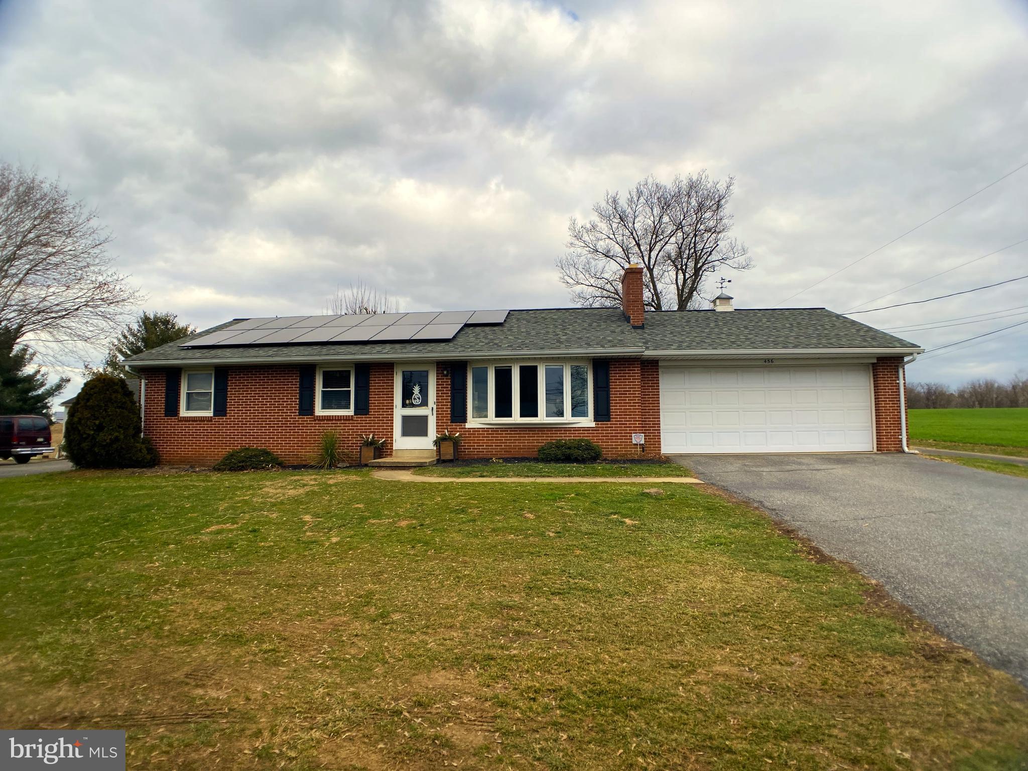 🏡 Welcome to your charming brick ranch home in Penn Manor Schools! Enjoy breathtaking country farmland views from this lovely "Nauman" built  home sitting on 0.41 acres. This cozy abode features three bedrooms, a spacious bathroom, new vinyl plank flooring, a converted  gas propane fireplace,  newer roof, replacement windows, new hot water heater, newer well pump, water treatment system, and   "The Air Scrubber" by Aerus,  which continuously cleans the ambient air from viruses, bacteria and other contaminants. Screened in porch to the rear.  With a two-car garage, central air, and a full basement ready for your personal touch, this home is perfect for creating cherished memories and a lifetime of comfort. Rural setting yet close to conveniences with Lancaster City being only minutes away. Don't miss the opportunity to make this your own slice of paradise! Solar Panels help reduce electric costs.