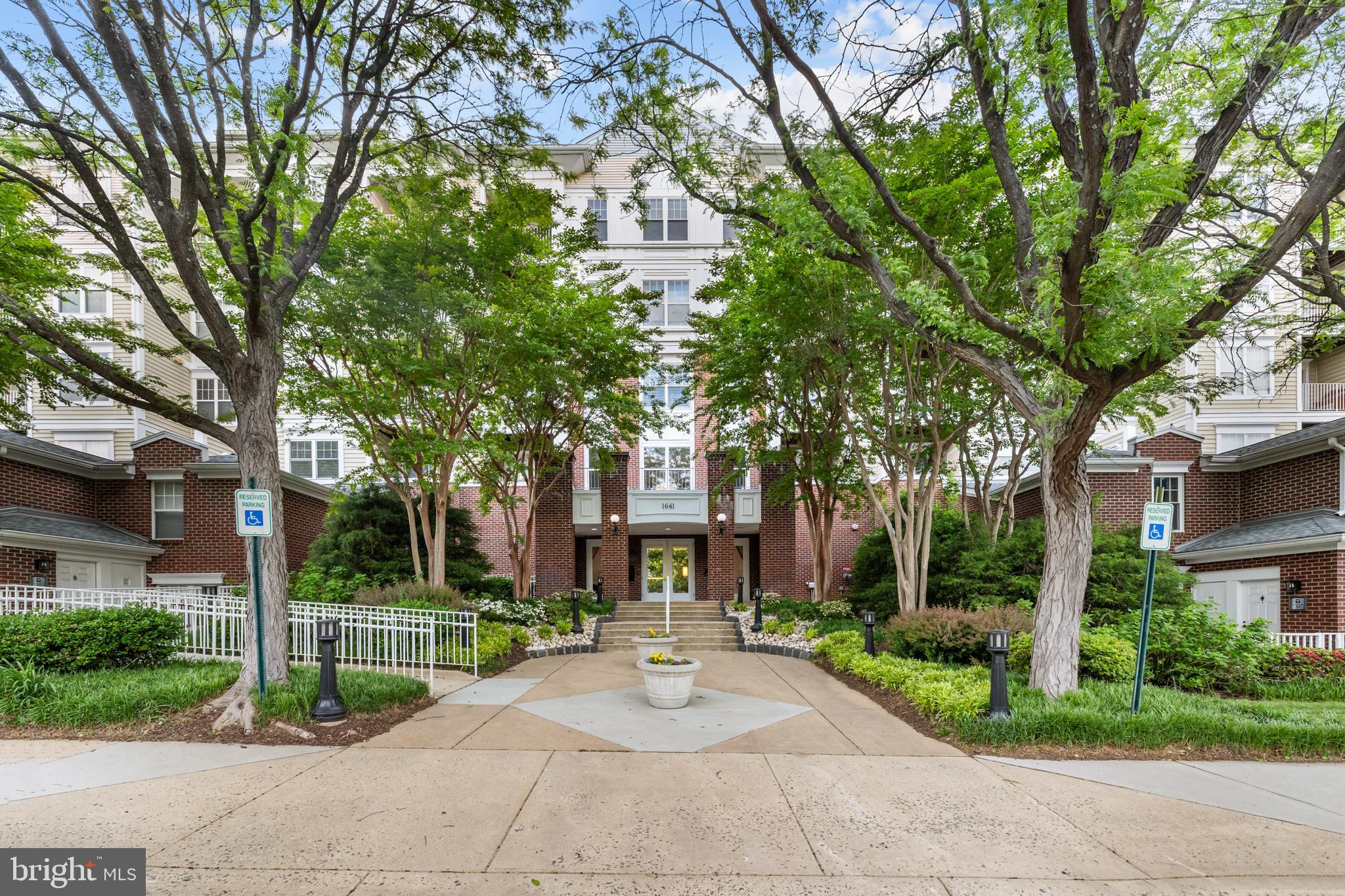 Freshly Painted and a Rare find! Location on this one is EVERYTHING.  Walking distance to Tysons!  Garage Parking! One of the few 2-level penthouse condo in sought-after Lillian Court at Tysons featuring 2 bedrooms and 2 full bathrooms. Beautiful only begins to describe this unit.  Enter the secured building and proceed to the 4th floor where this updated unit offers modern finishes and an open, light-filled layout. 
The renovated kitchen features stainless steel appliances, granite countertops, a custom backsplash, a gas range, and upgraded cabinetry. Spacious north-facing living room with a fireplace opens to the private rear balcony and adjacent dining area. It includes newer gleaming flooring throughout, upgraded bathrooms, and newer HVAC. 
Main level primary suite includes a vaulted ceiling, ceiling fan, custom closet organizer, linen closet, private balcony access, and an updated primary bath. A full-size washer and gas dryer are conveniently located in the unit.
Upper-level loft overlooks the living room and includes a fully updated bathroom with ceramic tile and a granite countertop. Second bedroom features a walk-in closet with a custom organizer. Additional under-stair storage provides extra functionality. 
Includes 1 garage parking space plus ample visitor parking. Ideally located minutes to Tysons Metro Station, Tysons Corner Center, shopping, restaurants, and major office hubs.