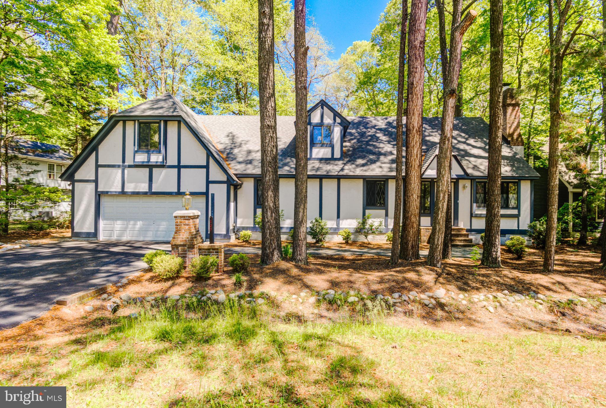 This gracious Tudor styled home is waiting for you to enjoy now. The seller had some needed maintenance work done. The open living, dining and kitchen greet you as you enter the home. 3 bedrooms on the first level along with 2 full baths. Wonderful Sunroom off the dining room plus a screened porch overlooking the private rear yard. Large deck for more outside enjoyment. Large 2 car garage has some extra space of tools and storage. Second floor has an open loft with lots of shelves for books or collectables. One more bedroom is the next room and has a full bath. Skylights and a nice size closet. Private office is the next room with separate rear access to the rear stairs It has a skylight and a small closet and could be another bedroom.  Seller will consider a credit to replace the carpet in the Living Room. Vacant and easy to see.
