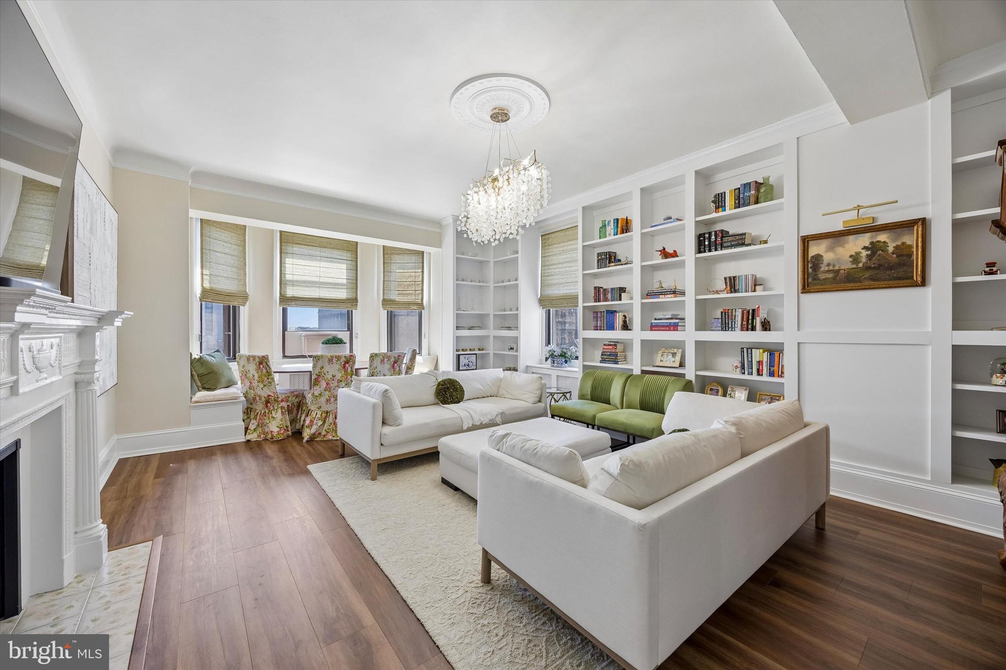 Welcome to Residence 8E at The Lenox, a beautifully re-imagined bi-level home offering over 1,700 square feet in one of Philadelphia’s most iconic condo buildings. This distinctive residence blends timeless architectural character with thoughtful modern updates, featuring a dramatic two story entry, sweeping circular staircase, restored original banister, soaring ceilings, oversized windows, elegant moldings and a gracious layout rarely found in condominium living. The main level offers an expansive living room with custom built-ins, a restored ornamental mantel, recessed lighting and plenty of natural light. The renovated kitchen features custom cabinetry, paneled appliances, quartzite countertops and beautiful fixtures. A stylish powder room and tucked away office nook add both charm and functionality. Also on this level is an additional bedroom that is currently being used as a secondary living area and includes an extra refrigerator, creating flexible space for guests, lounging, or work from home needs. Upstairs, the layout has been reconfigured to create 3 bedrooms, offering a more functional and versatile upper level. The full bathroom has been beautifully renovated and the spacious primary suite offers excellent scale, natural light and a walk-in closet with a washer and dryer along with room to add a second full bathroom if desired. No expense was spared in the extensive renovation of this home with thoughtful, high-quality improvements throughout that beautifully balance modern comfort with the unit’s original character. The Lenox is a full-service doorman building in the heart of Washington Square West and is within close walking distance to many shops and restaurants. Schedule your tour today!
