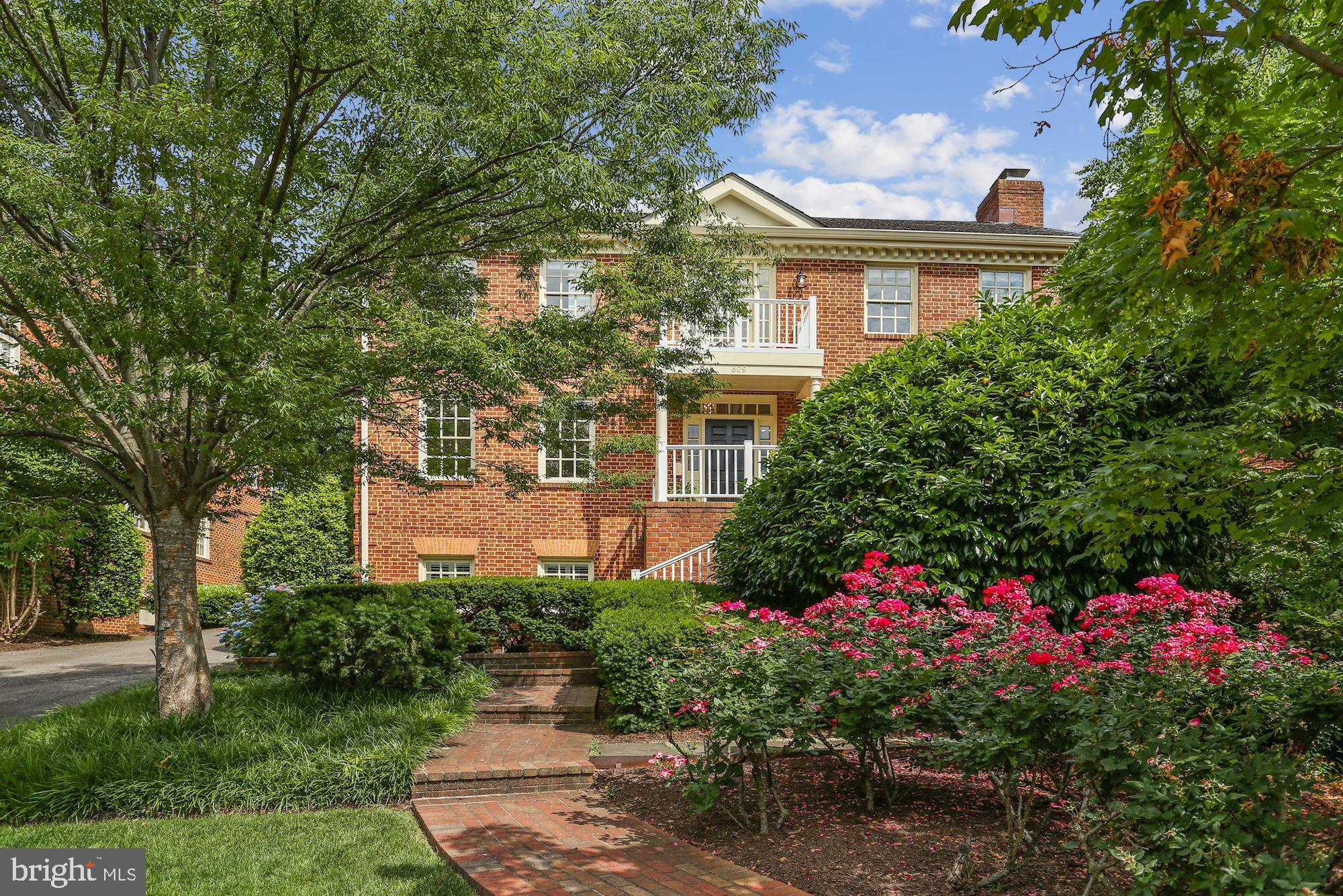 REFRESHED AND BACK ON THE MARKET WITH TERRIFIC NEW PRICE! 
Elegant custom built  all  brick center hall colonial with grand, two story entry,  marble floor and grand staircase is simply stunning! The  gorgeous sun drenched formal living boasts a  wood burning fireplace with  decorative recessed mantel surround, crown moldings and hardwood floors. The equally bright and sunny  dining room easily seats ten and offers chair rail and shadow box detail, crown molding and hardwood floors. Both the living and dining rooms wrap around into the kitchen and breakfast nook, creating a fabulous circular flow for every day living and entertaining. The kitchen offers a center cooking island with brand new gas cooktop,  granite countertops, separate breakfast area and pass through  to the adjacent  family room. The family room offers a cozy brick hearth fireplace, a fabulous wet bar and double French doors to the generous slate patio, complete with  hot tub, fire pit and fountain!
 in the  fully fenced rear  gardens. Off the family room is a beautifully staged wet bar with ice maker and ceramic tile floor. From the the two car garage is a back staircase leading to the au-pair suite above the garage with private entrance full  bath and loads of closet space. There is extra storage in this area in finished closets under the dormers. 
The upper level has a catwalk overlooking the gorgeous two story entry and leads to the four bedrooms on this level. The  primary bedroom offers a  cathedral ceiling, wood burning fireplace surrounded by built in bookcases, a  sumptuous bath boasts both a  separate tub and shower and huge walk in closet. The primary bedroom features a lovely private balcony overlooking the serene fully fenced rear gardens and slate patio.  Down the hall just a few steps is a second bedroom which has direct access to the primary bedroom and could easily be a study or nursery.  The two additional bedrooms on this level are at the other end of the hallway and share a hall bath. 
The lower level boasts a spacious recreation room with brick hearth fireplace, plenty of room for a pool table and a football table AND a brick wine cellar! On this level there is a fifth, currently set up as an exercise room, a laundry room, newly completed full bath and utility room with backstairs to the driveway outside.
Above the two car garage, there is a second staircase leading to an au pair suite with private bath and loads of storage.
The fully fenced rear garden offers a large slate patio, a fire pit, fountain and hot tub , a perfect outdoor space for an afternoon or evening  of  entertaining or quiet time at home. The lush landscaping in the gardens in the front, back and on the side offie opportunities to gather fresh flowers for the house!
Fireplace in primary bedroom to convey in as is condition.
