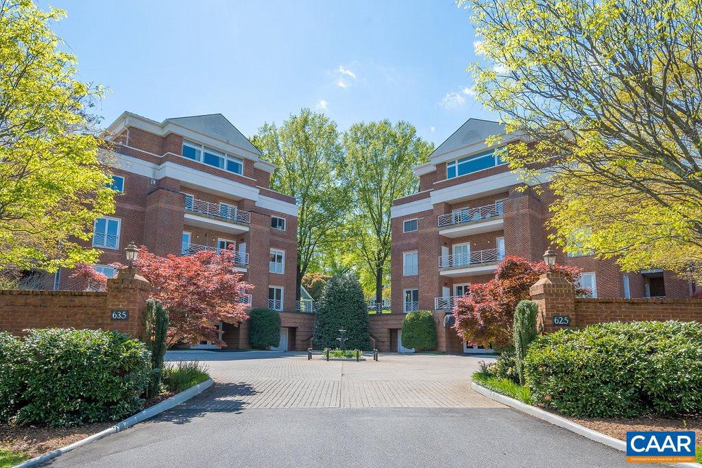 In 1 of 2 coveted Worthington Drive condominium buildings, this 2 bed, 2.5 bath corner unit offers 2 covered terraces as well as a wraparound terrace.  Patio square footage totals 568 square feet & provides Blue Ridge views! Enjoy direct access to the lovely, shaded gathering area between the 2 buildings, also  great for a quick dog walk.  Further, this corner unit enjoys a slice of fenced, private yard, again ideal for pets as well as expansive outdoor entertaining.  This unit enjoys 10ft ceilings and includes formal dining & living, den/sitting room, eat-in kitchen, laundry room w/ rear service entrance & office. The office could be incorporated into the kitchen area to create a larger kitchen & more open, casual living space. 2 secure parking spaces on the 1st level of the building, where there are also large storage units.  Walk to the Boar's Head Resort, Sports Club and Birdwood Golf Course or walk across the street to Farmington amenities.,Granite Counter,Painted Cabinets,Solid Surface Counter