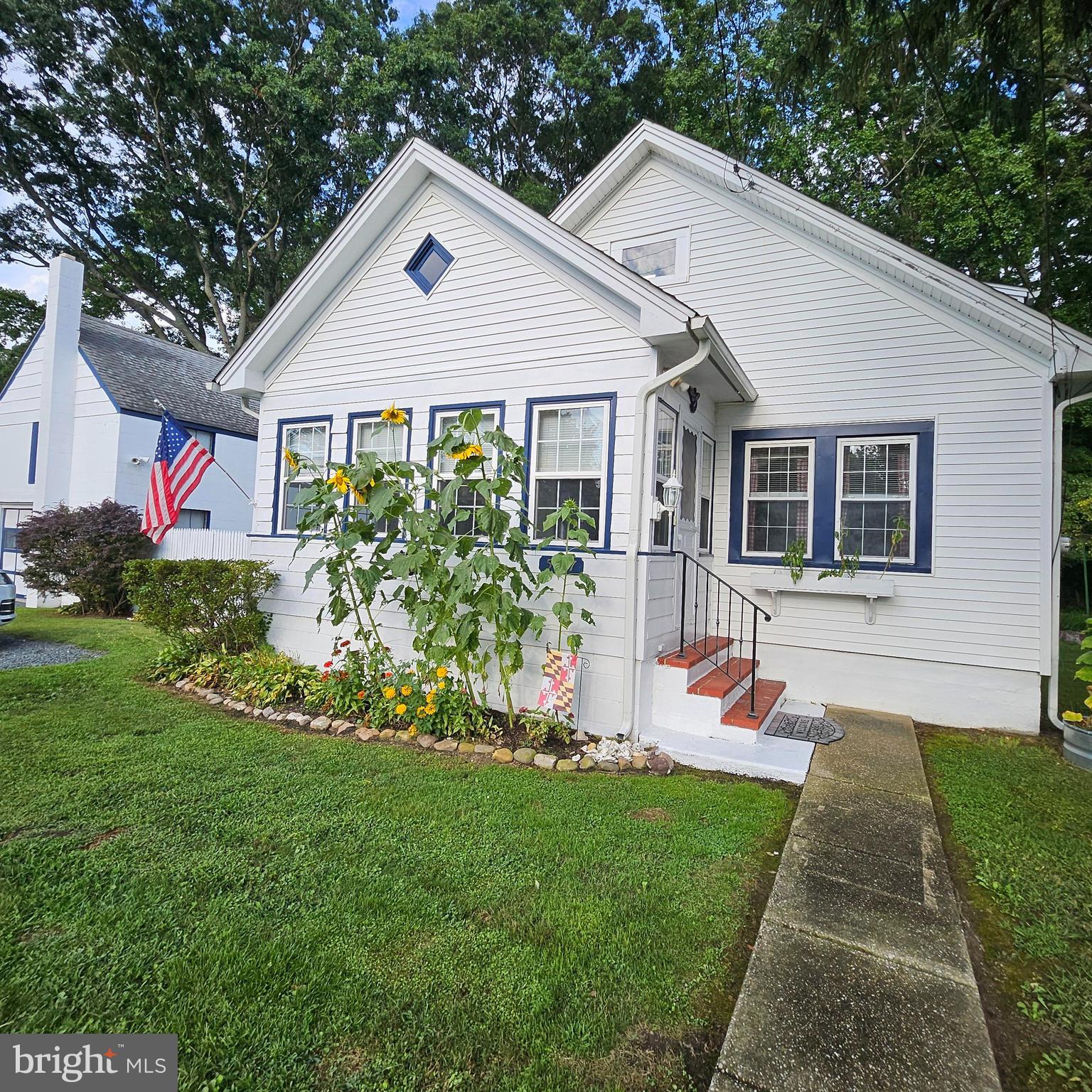 Just a block and a half from the water, this adorable Cape Cod is the retreat you’ve been dreaming of.  Whether you’re looking for a peaceful primary residence, a weekend or vacation getaway, or an investment property to Airbnb, this home perfectly balances cozy character with nearby conveniences. Peace and quiet doesn’t mean being disconnected. You're just a short stroll or drive from downtown shops and dining, giving you the best of water community living and small-town convenience, such as quaint downtown shops, restaurants like Harbor Shack,  Rock Hall Brewing Company, The Little Lemon Leaf Diner, Ford's Seafood, ice cream from Get the Scoop, and much more.  Yearly Rock Hall events such as Pirates and Wenches Weekend, 4th of July Celebration, FallFest, Blessing of the Fleet, Waterman's Day, the Lighted Boat Parade (and so much more) will keep you entertained all year long.  Inside the home, enjoy a roomy living room and dining room area that's perfect for hosting guests or quiet nights in.  Three bedrooms make for ample space for you and your guests.  The second floor bedroom can be left as is, turned into a primary suite, separated into two bedrooms, made into a game room, crafting room, or gathering space -  light up your imagination with the possibilities.  On the front and back of the home are enclosed porches, great for sipping your morning coffee or enjoy a cozy afternoon in the bright and welcoming space.  The detached, oversized 1-car garage offers work and storage space and has an upstairs loft that provides incredible potential for a studio, apartment (plumbing needed), or additional storage.  Don’t miss this rare opportunity to own a slice of paradise near the water!  Tell your agent that this is the one and have them schedule your showing today.  :)