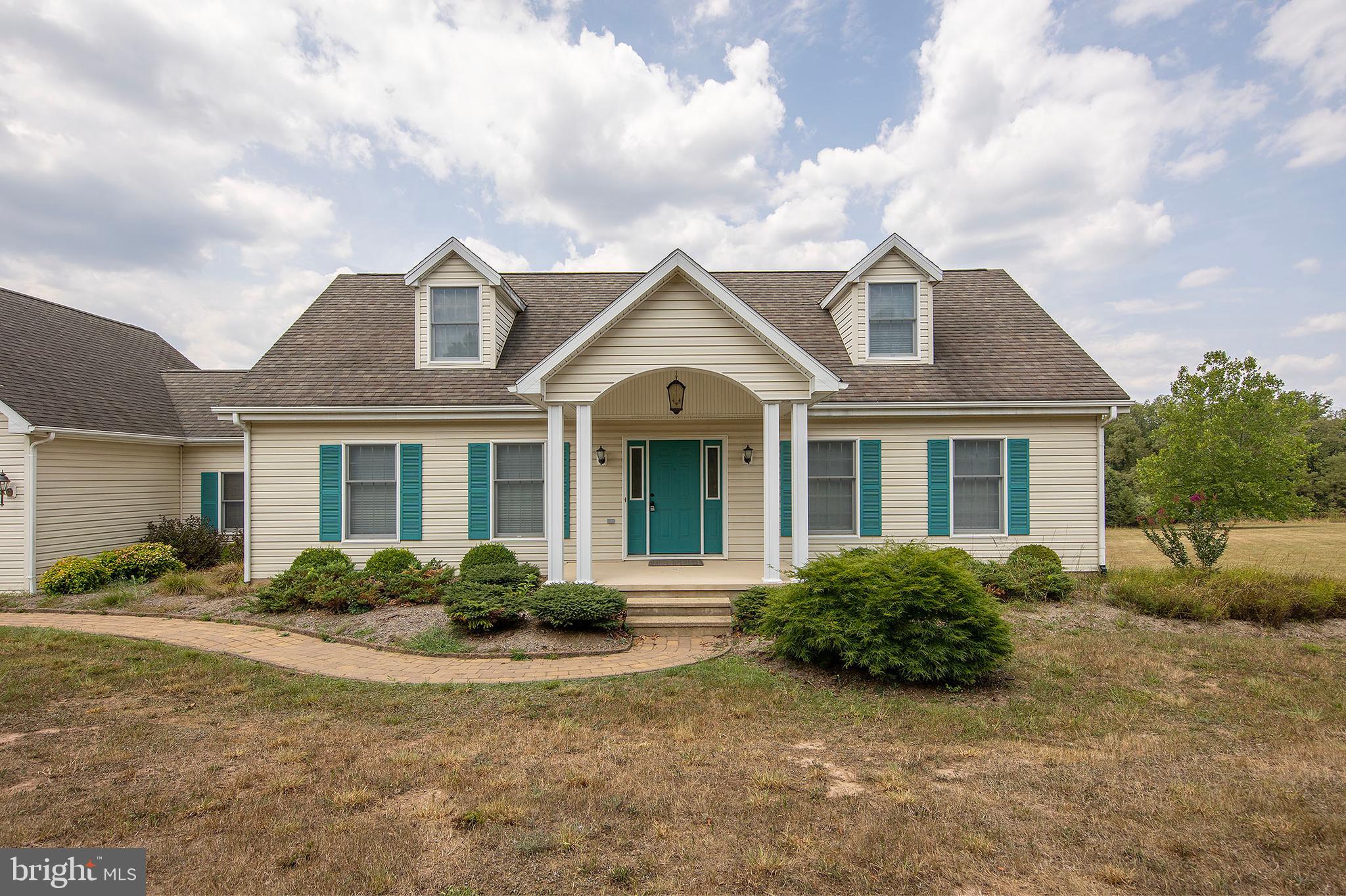This charming Cape Cod-style home features two stories and boasts over 1,800 square feet of well-designed living space. The main floor includes a spacious primary suite with a large walk-in closet, a separate shower, and a luxurious soaking tub. Conveniently located on this level, the main half  bathroom is equipped with a washer and dryer for added ease.

The heart of the home is the expansive kitchen, complete with a wall oven, gas stovetop, dishwasher, and ample cabinet space. An adjacent dining area provides a perfect space for family gatherings, while a cozy sitting area connects the garage to the kitchen, enhancing the home’s charm. A large living room and a welcoming foyer complete the main level.

Upstairs, you'll find two additional large bedrooms and a full bathroom, providing plenty of space for family or guests. The home features dual-zone heating and air conditioning for year-round comfort.

Set on a quiet road with no through traffic, this property is beautifully landscaped to complement the home. It’s ideally located just 45 minutes from Winchester, VA, and a short drive to Washington, D.C., making it perfect for those who want a peaceful retreat with easy access to city amenities. An unfinished basement and a two-car attached garage add to the home's excellent features and layout.