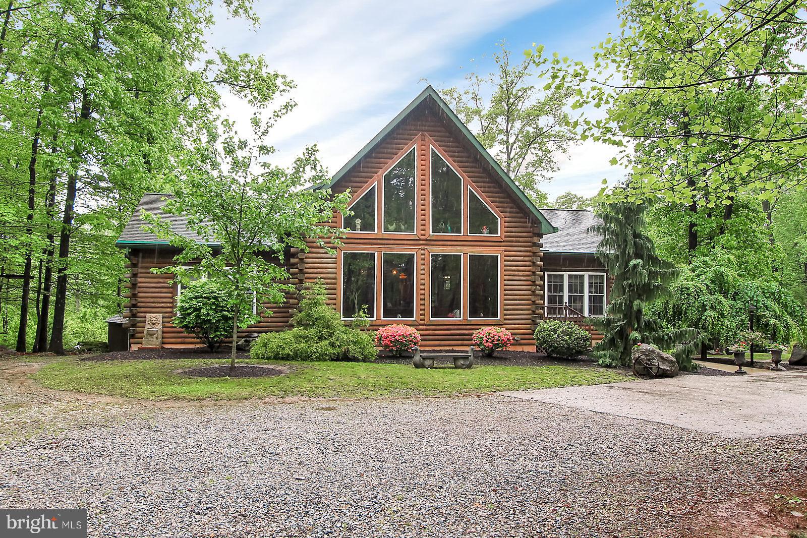 This Gentleman's farm is sure to impress! The living room is bathed in light from the grand windows and features a stone FP.  The open floor plan is perfect for entertaining   The 1st floor master bedroom suite is spacious with a walk in closet, and a full bath. Additional 1st floor bedroom or office showcases beamed ceilings and a bath. 2nd floor master suite has a bath and stone FP.  The basement has ample storage and is partially finished with door to the patio.  The barn features 6 stalls, an office, a hay loft and electronic stairs. The possibilities are endless-this property would make a great bed and breakfast, doggie daycare, alpaca farm, raise small livestock, horses, whatever you can dream up-just don't forget to check with the township to make sure it's allowed.   This beautiful  property has too many features to mention here but a list is in associated docs.