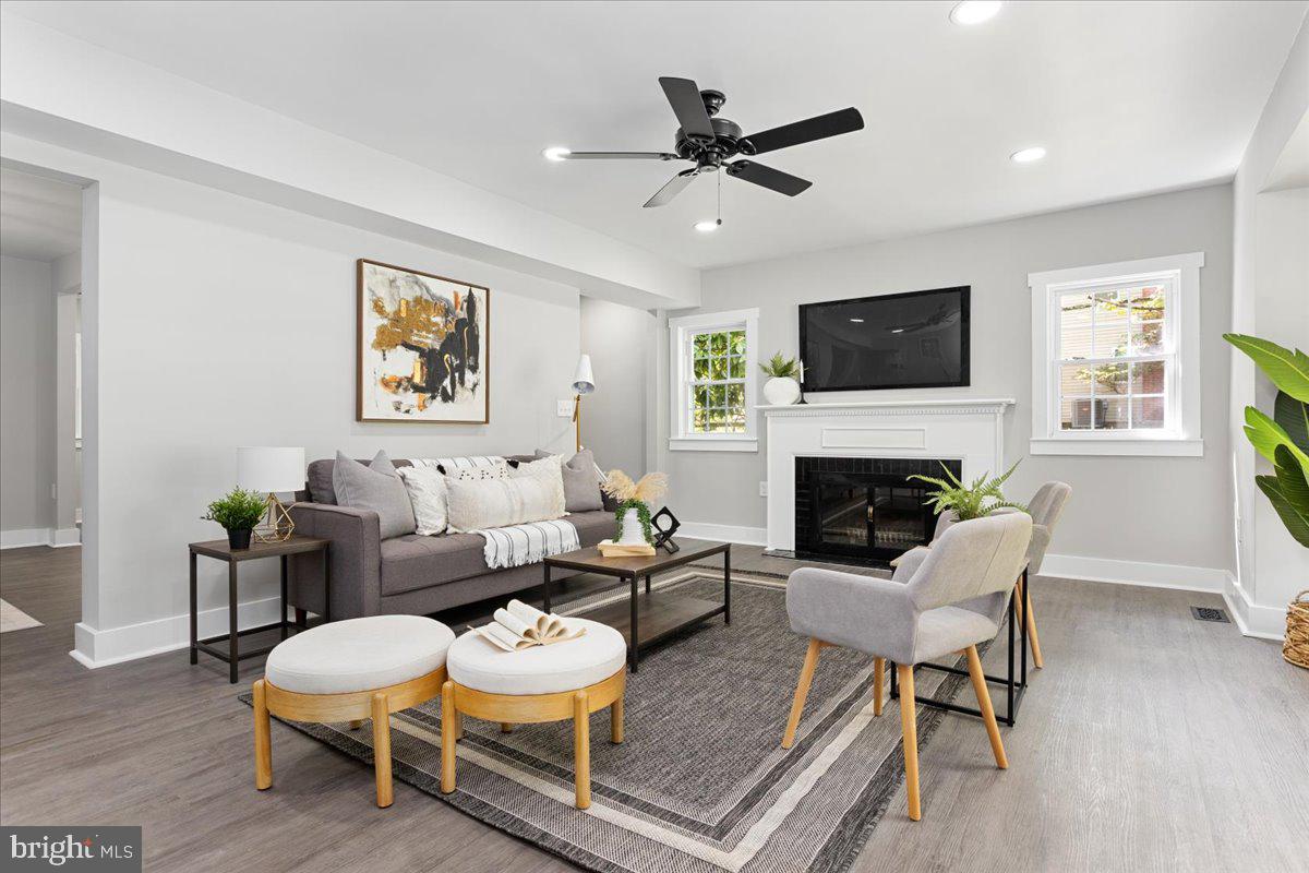 Welcome to this stunningly renovated Cape Cod farmhouse located in Towson, Maryland. With 2500 +/-sq ft of living space, this home boasts 4 bedrooms and 3 full custom tile baths, as well as a detached car port for 2 cars. Step inside and be greeted by luxury vinyl plank flooring throughout the first level, highlighting the wood-burning fireplace and picture window that looks out over the front yard. The interior of this home is a dream, featuring a kitchen with stainless steel appliances, quartz countertops, an island, and tile backsplash. The kitchen dining combo opens up into a spacious living area with exposed wood beams and a dining room combo. Need more space? Check out the fully finished basement. Love the outdoors? You'll fall in love with the huge deck and mature landscaping with private trees. This home is located right next to Loch Raven Watershed, perfect for biking, hiking, fishing, and enjoying nature. Don't miss your chance to own this beautiful modern Cape Cod farmhouse in Towson, Maryland. Call today to schedule a tour.