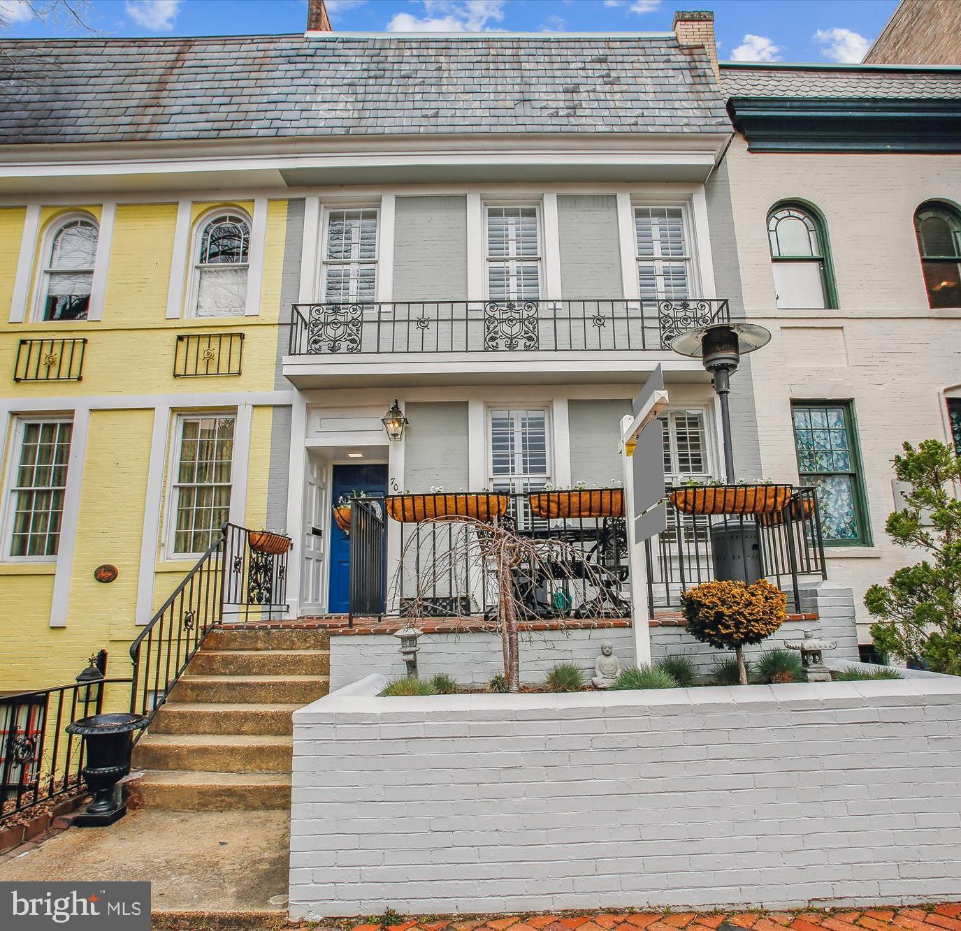 Experience the epitome of turnkey living in this breathtaking Old Town rowhome, boasting a unique opportunity for eligible buyers: an assumable VA loan at an enticing 3% interest rate. From the moment you approach the home, you're welcomed by a charming elevated patio and a raised flower bed, setting the stage for what is within.

As you step inside, the home opens up to a bright and spacious floor plan, renovated in 2020 to merge modern comforts with timeless elegance. The interior is adorned with hardwood floors, soaring ceilings (over 9ft), crown molding, and custom real-wood plantation shutters, complemented by a distinctive custom, vintage-brick exposed wall that adds character and warmth to the space.

The front of the home is thoughtfully designed with a living room, dining area, and a convenient half bath, leading to a centrally located kitchen. This culinary space is a chef's dream, featuring a center island, an abundance of counter space, and extensive cabinetry. Adjacent to the kitchen, the family room provides a cozy retreat with direct access to the deck and the convenience of TWO off-street parking spaces in the rear. This open main level is perfect for family time and social gatherings!

Ascend to the upper level to discover the primary bedroom suite, complete with an en-suite bathroom and a spacious walk-in closet. Two additional bedrooms share a Jack-and-Jill bathroom, with the added luxury of laundry facilities on the same level.

The basement offers versatility with a fourth bedroom, a third full bathroom, and a large recreation room currently serving as a gym and media space. Additional washer/dryer hookups in the basement and direct exterior access provide potential for an au pair or in-law suite. Recent upgrades include a new roof and gutters in 2023, a new HVAC system in 2022, and storm windows with UV coating on the rear of the house. A new beverage fridge in the kitchen adds a final touch of convenience to this immaculate home.

This residence is not just a house, but a home ready for new memories, further enhanced by the rare benefit of an assumable VA loan at 3% interest, offering significant savings for eligible buyers. Don't miss this unparalleled opportunity—contact the agent today for more details and to make this dream home your reality.