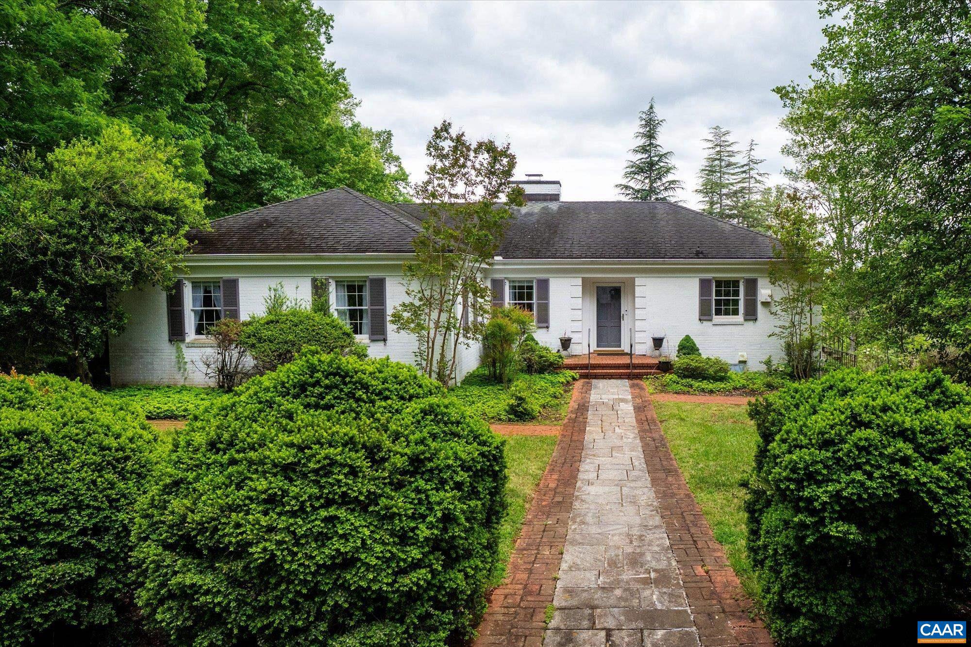 Classic all-brick ranch on nearly 3 acres in the coveted Spicer Mill Farm corridor of Orange County ? offered as two adjacent parcels (1.86 ac + 1.07 ac) conveying together. The 1,972 sq ft main home features 4 bedrooms, 2 full baths, hardwood floors, a wood-burning fireplace (with electric insert), and central A/C. A sprawling 764 sq ft screened porch extends the living space and overlooks the private, tree-lined setting ? a rare find. Additional improvements include a 768 sq ft garage with workshop space, gazebo, and paved driveway. Partial basement (493 sq ft) offers storage or workshop space. Solid brick construction throughout. The adjoining 1.07-acre parcel provides added privacy, expansion potential, or the option to build. Public electric; septic. Sold as-is. Priced to reflect opportunity. Schedule your showing today!,Painted Cabinets,Fireplace in Living Room
