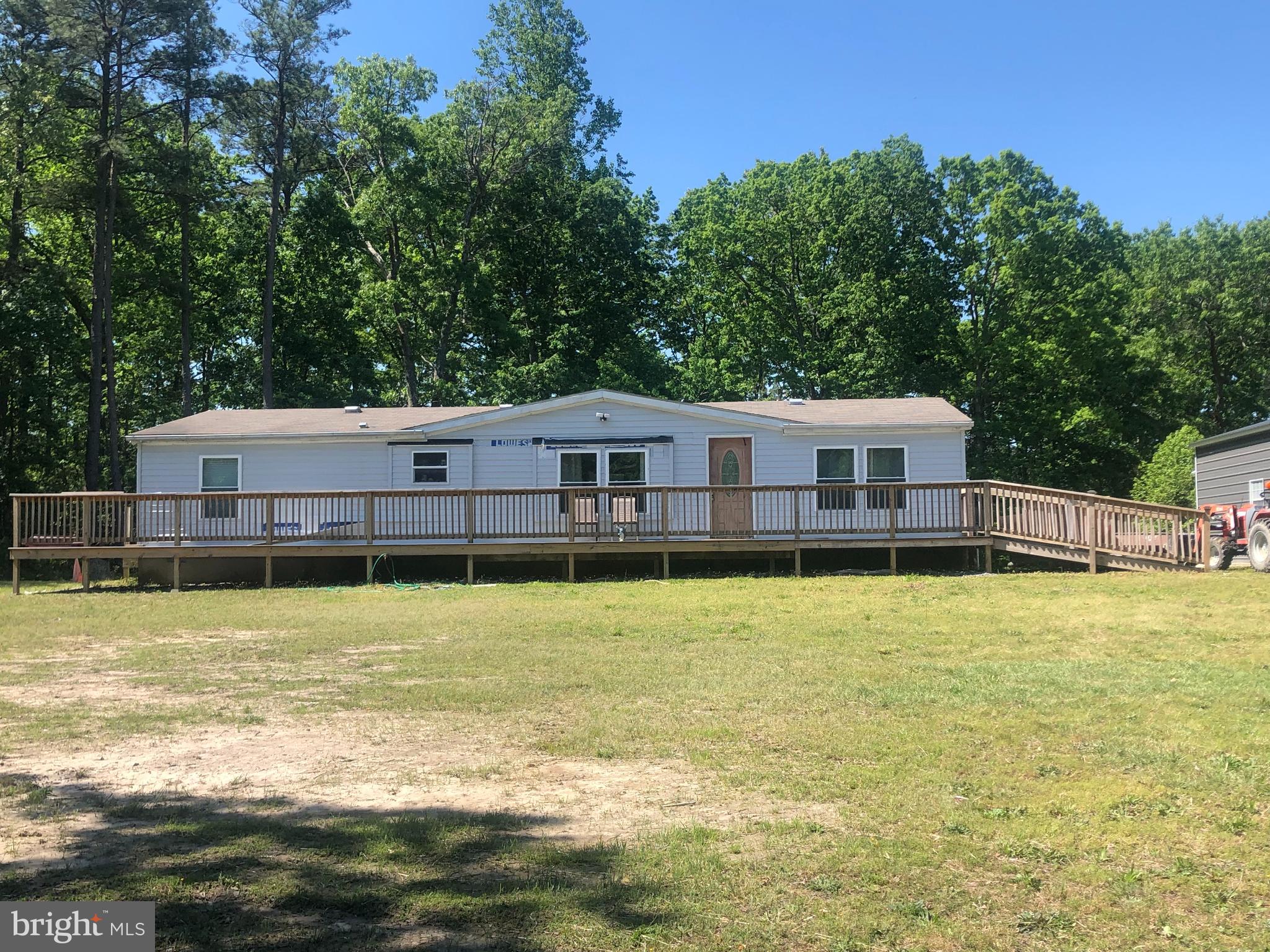 Beautiful ten acre parcel with small pond, nice manufactured home and two car garage/shed.
