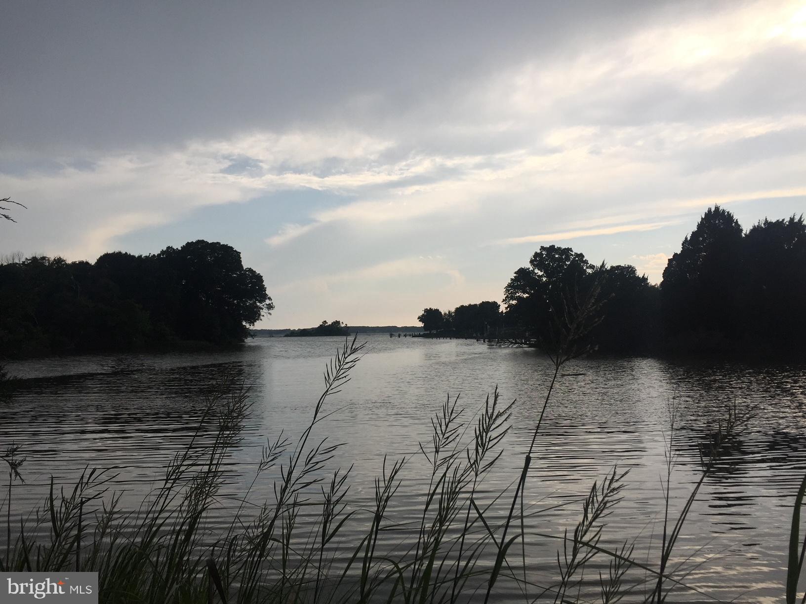 Paradise at the Point describes this almost 3/4 of an acre waterfront lot with beautiful sunsets. Community fishing pier, boat ramp, basketball court, and clubhouse.