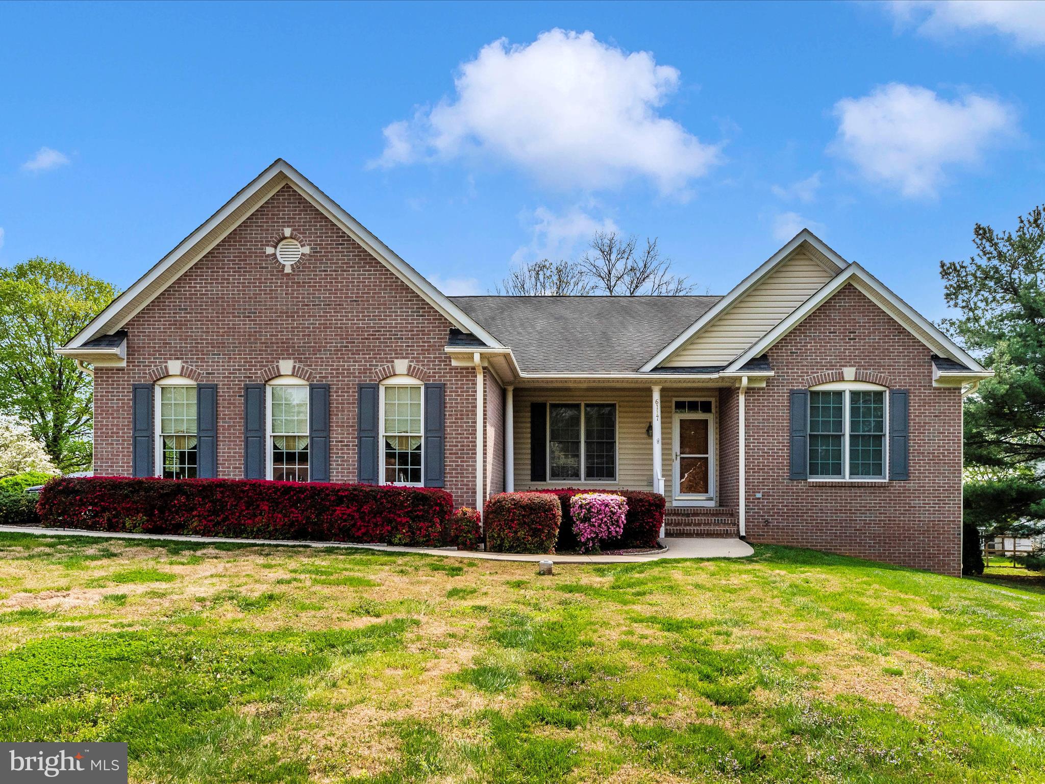 **Best and Final due Monday 5/4 10am** Welcome to 6117 Old Washington Rd.  in beautiful Sykesville, MD! With a combination of  brick and siding exterior, this meticulously maintained 3-bedroom, 2-bath rancher offers 2,097 sq ft  above ground of comfortable, single-level living on a spacious 0.53-acre lot.  The hallway is finished in wood-like LVP flooring, adding warmth and continuity to the home's flow.  The HUGE family room features Berber carpet, abundant natural light, and a cozy propane fireplace—perfect for relaxing or entertaining. 
The eat-in kitchen, fully renovated in 2019, is a chef’s dream with LVT flooring, solid surface countertops, stainless steel appliances, double oven, propane cooktop, and generous cabinet storage—including a built-in filing system for added functionality. From the kitchen, step out onto the composite deck with vinyl handrails, ideal for grilling or enjoying your morning coffee. A formal dining room with a pocket door provides flexible space for gatherings or a home office setup. The spacious primary bedroom features a large closet with built-in shelving, while the primary bathroom impresses with double sinks, a soaking tub, fully updated tile shower, ceramic tile floors, and a custom built-in cabinet. Both additional bedrooms are large and include closets with built-in shelving.  The second full bath offers a tub/shower combo with ceramic tile flooring. Major systems are thoughtfully updated and include: Propane heat with a new furnace (2015), Electric A/C heat pump (2022), Propane hot water heater, whole-house propane generator (2023), water softener & filtration system, and even a Radon remediation system.
Located just minutes from historic downtown Sykesville, named “Coolest Small Town in America”, you’ll enjoy easy access to quaint shops, cozy cafes, restaurants, and farmers markets. Spend weekends exploring Piney Run Park and the Sykesville Rail Trail.  Commuters will appreciate proximity to major routes and easy access to Baltimore or Frederick. This beauty is truly move-in ready, and you won't be disappointed!