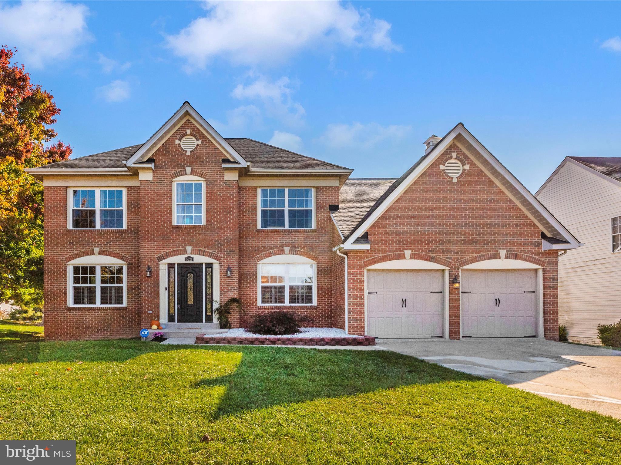 ALL OFFERS DUE BY 8pm 10/27. Offers will be presented Monday morning. 

Professional photos coming Friday morning! Welcome to this stunning brick-front colonial home on a coveted corner lot in the commuter-friendly community of Kingsbrook. From the moment you arrive, the beautifully manicured yard and stately brick exterior make a statement of grandeur and curb appeal.

Step into the foyer, where gleaming hardwood floors greet you and adorn most of the main level. To the right, a bright and airy home office offers views of the front yard, providing the perfect work-from-home space. On the left, the formal living room is bathed in natural light from the front and side windows, offering an elegant setting for gatherings. Flowing seamlessly from the living room, the formal dining room is an impressive space with a beautiful hardwood accent border and ample room for hosting large family meals or holiday celebrations.

At the heart of the home, between the dining and family rooms, sits the spacious kitchen. With white cabinetry, a central island, granite countertops, and stainless steel appliances, this kitchen is made for entertaining. The eat-in area, enhanced by a bay window, adds even more charm and space for casual dining. Conveniently located off the kitchen is the laundry room and access to the attached garage.

Step down into the generously sized, carpeted family room—perfect for relaxing or creating a space that suits your decorating vision. Just off the family room is a large, inviting sunroom, ideal for enjoying the changing seasons or year-round relaxation. The current owners leave the doors open, finding it stays comfortable year-round. From the sunroom, access the fully fenced backyard—a manageable yet spacious outdoor area, perfect for all your needs and easy to maintain.

Back in the foyer, head upstairs via the carpeted staircase to the second level. The upper hallway is finished with sleek laminate wood flooring. To the left, the main full bath has been recently updated and shows beautifully. Three large secondary bedrooms on this level provide ample space for family or guests. To the right of the staircase, you'll find the expansive primary suite—a true retreat. This massive room offers the option to be converted into a fifth bedroom if needed, or it can be enjoyed as is, with a spacious sitting or exercise area. The newly renovated en-suite bath features a dual-sink vanity, a separate glass-enclosed shower, and a luxurious soaking tub, creating a private sanctuary you'll love coming home to.

The fully finished basement offers even more living space, currently set up as in-law quarters, complete with a large rec room, full bath, and plenty of storage for all your extra belongings.

This impressive home is move-in ready and waiting for you to make it your own. Don't miss your chance to experience the charm, space, and convenience this Kingsbrook gem has to offer!