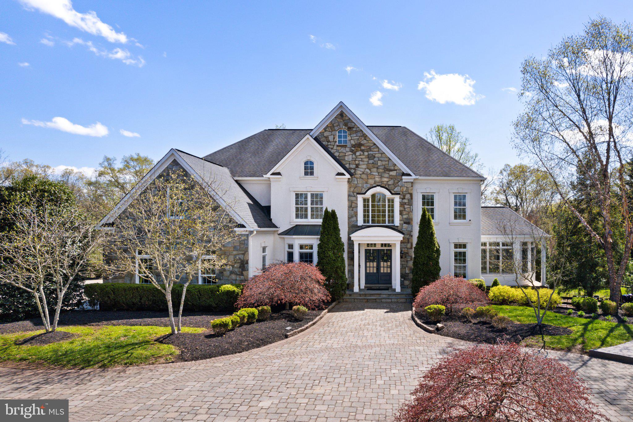 Paradise Farm is an exceptional 10-acre property in Nokesville's sought-after Kendall Knolls community, blending privacy, convenience, and standout amenities. The stone and stucco exterior, paired with a newer architectural shingle roof ('18), creates a striking first impression. A double glass door entry and covered portico welcome you inside. The custom paver circular drive leads to the attached 3-car garage, while a separate 2-car garage/shop ('23) sits near the barn. The outdoor oasis—with resort-style paver pool decking and patio—surrounds a shimmering sports pool with newer coping and plaster ('22), baby pool, and spa, offering the perfect setting for both relaxation and entertaining. Equestrian enthusiasts will appreciate the updated ('23) barn with 5 stalls (4 with walk-outs), HayGain memory foam flooring, a wash rack with tankless hot/cold water, a feed room with utility sink, a tack room with stone pavers, and a large storage room. Newly painted (‘25) fenced paddocks, a run-in shed, and a professionally built 100’ x 200’ riding ring (‘23) with crushed blue stone footing complete the setup. A motorcross practice track sits in a field that could easily be converted to pasture, if desired. Inside, a grand 2-story Foyer greets you with custom moldings and a refinished (‘23) curved hardwood staircase with decorative metal railings. The Living and Dining Rooms feature newly refinished hardwood floors (‘25) and elegant moldings, with a Butler’s Pantry off the Dining Room for added convenience. The Chef’s Delight Gourmet Kitchen is the heart of the home, offering a large center island, 42” freshly painted cabinets (‘25), sleek granite countertops, trendy hardware (‘25), new tile (‘25), recessed lighting (‘25), updated stainless appliances (fridge & dishwasher – ‘23 / cooktop – ‘21), and a walk-in pantry with an organization system (‘20). The Breakfast Room with new tile (‘25) opens to a spacious Family Room with refinished hardwood floors (‘25), gas fireplace, and new recessed lighting (‘25). Off the Kitchen, a refinished (‘23) back hardwood staircase leads to the Upper Level with 5 bedrooms and 4 full baths. The light-filled Sunroom with tray ceiling offers deck access, while a private Study with built-ins, Half Bath, and side Solarium with refinished hardwood floors (‘25) add versatility. The Mud Room with built-ins connects to the garage and another Half Bath. Upstairs, the hardwood hallway (‘23) leads to 5 bedrooms with new neutral carpeting (‘25). The Primary Suite is a peaceful retreat with a soaring tray ceiling, sunlit Sitting Area, and two walk-in closets (one with custom system – ‘21). The fully updated spa-like Bath (‘25) features a luxurious freestanding tub, oversized dual-head shower with a seat, raised double vanities, a water closet, and upgraded tile, lighting, and fixtures. Bedrooms 2 and 3 each have Ensuite Baths (updated full bath off Bedroom 3 – ‘25), while Bedrooms 4 and 5 share a bath with a double vanity. The spacious upper-level Laundry Room adds functionality with tile flooring, built-in cabinets, and a granite countertop. The Finished Lower Level offers a sun-filled walk-out elevation, newer LVP flooring throughout most of the space, and flexible living areas including a Rec Room with granite-topped bar, Media Room, Exercise Room, Bedroom 6, Den/Office, and a Full Bath with shower/tub and single vanity. Additional recent updates include a water treatment system (‘24), 4-zoned HVAC (‘22), pool filter (‘24), and more. Listed below recent appraised value, this property offers incredible features and value—inside and out!