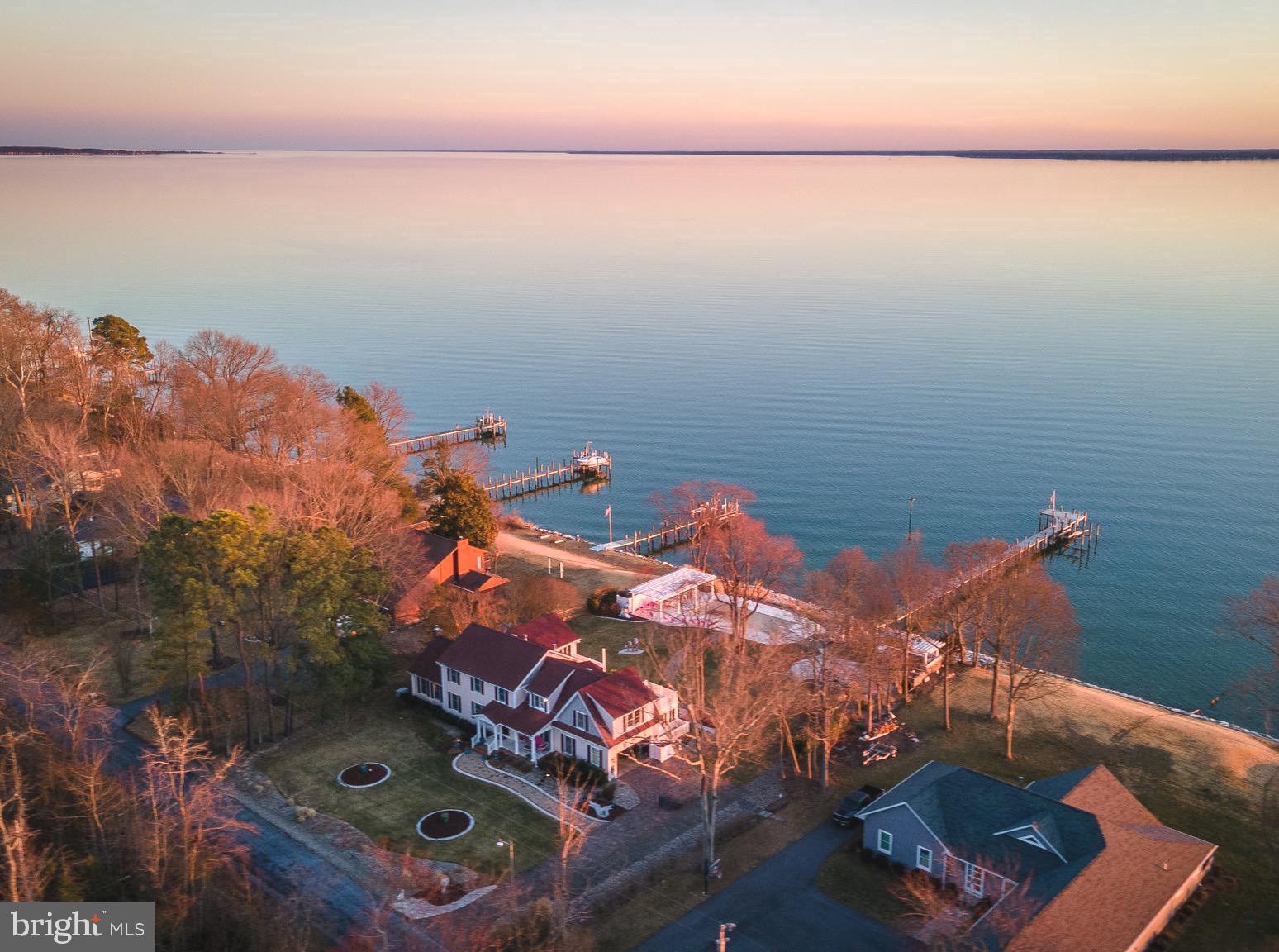 Custom waterfront home on the Potomac River with breathtaking panoramic views. Designed for both family living and entertaining, this spacious residence boasts a thoughtfully remodeled gourmet kitchen by St. Maries Builders, a family room, sunroom, living room, and a large den with a full bath on the main level. Expansive windows maximize natural light and showcase stunning sunsets.

The upper level features four bedrooms, three full baths, and a versatile sitting room or office, with multiple rooms offering access to private balconies.

Outdoor highlights include a newly renovated Gunite pool with custom tile, a gazebo, a screened porch, a travertine deck, an outdoor kitchen with a new grill, and a firepit. The private pier has water &  electric and features a boat lift.   The shoreline is protected with riprap. The professionally landscaped grounds also include a paver driveway, high-speed internet, and a generator for peace of mind.