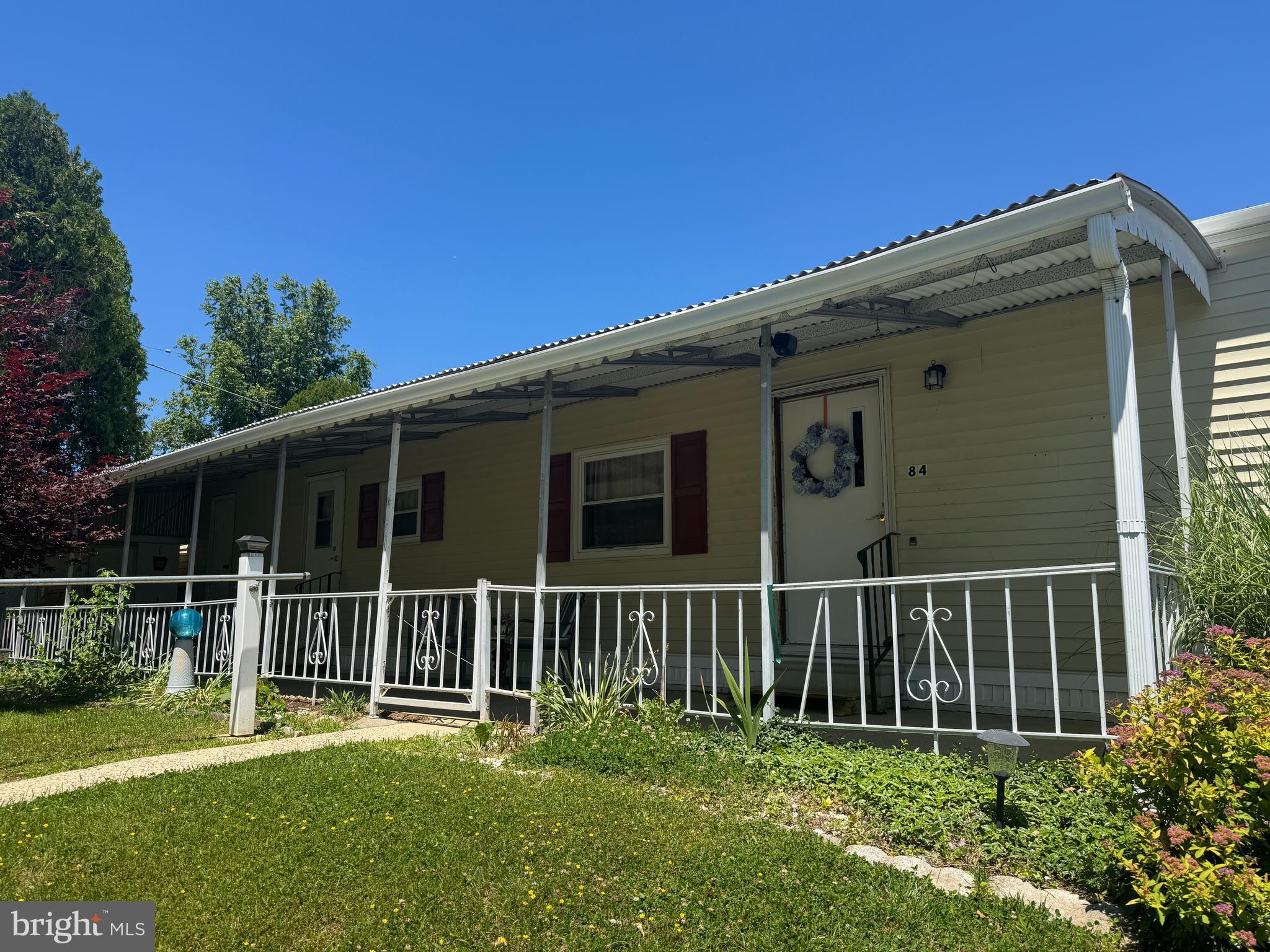 Where can you find a home for less than $100,000 in today's market? Easy one floor living in Village Green +55 Senior Community. This home sits on a PREMIUM lot with it's own front porch to relax and enjoy nature. Recently updated to include NEW Central Air (2026), Water Heater (2026), Stainless Steel Range and Hood (2026). Flooring was replaced 2023. This 2 bedroom home with full hall bath featuring a walk in shower along with nice size living room and eat in kitchen, and main level washer and dryer will be a pleasure to call home. Low taxes too! Need some extra space? There is a shed as well to store your seasonal things and much more. Centrally located near shopping, restaurants, Riddle Hospital, Medical Facilities, Urgent Care, Wawa, I95, I476 and so much more. Don't miss out on this affordable home with carefree living. Home being sold As-Is.