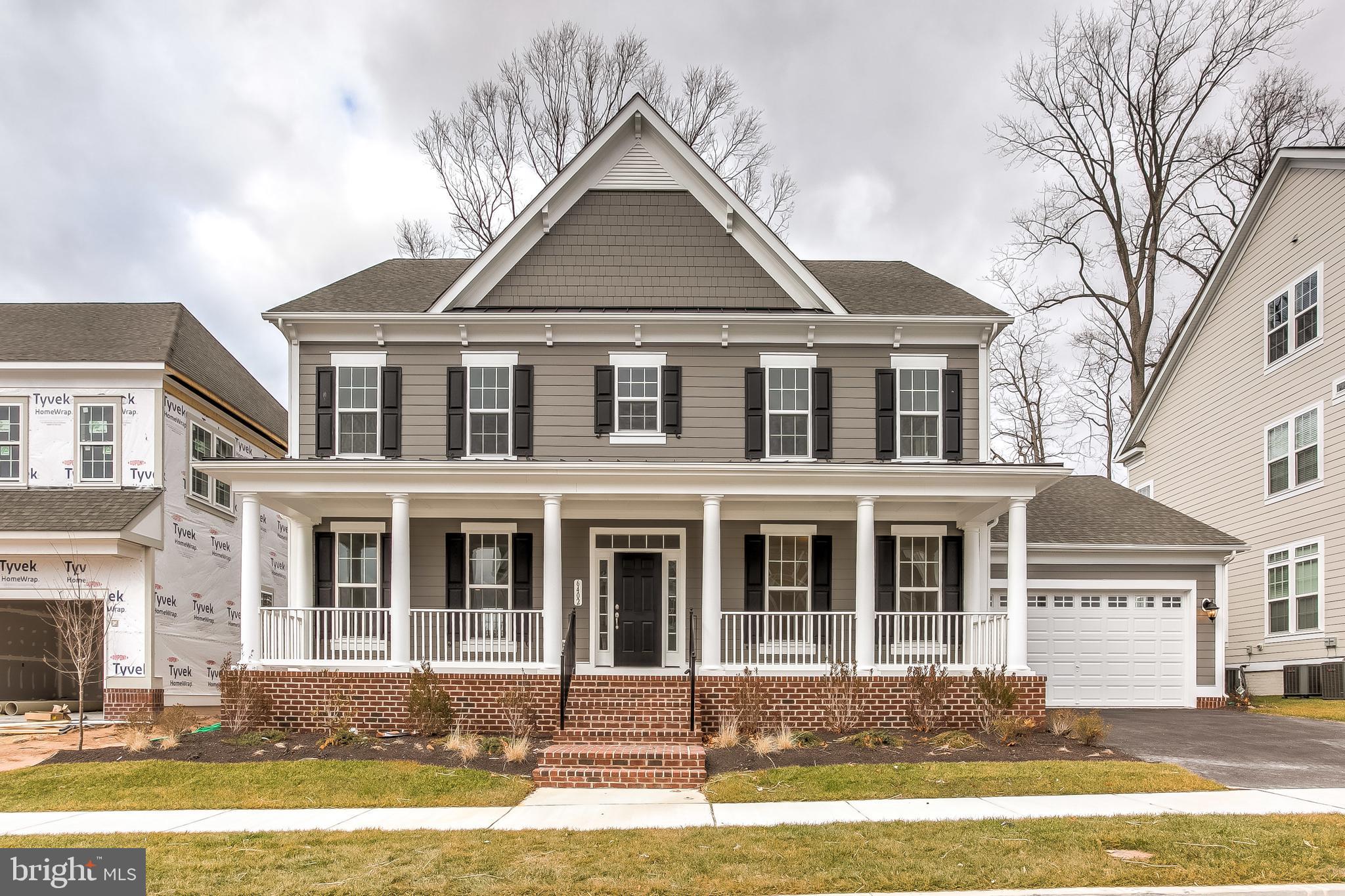 Welcome Home to this beautiful  4 BR 4.5 Bath home in Greenleigh neighborhood.  Located on quiet street, backing to trees/farmland.  Front load 4 Car tandem garage!  Mega 42' X 8' porch across front of house.  Oversized family room on 1st floor with upgraded carpet.  Large mudroom with built in cubbies.  Finished Lower Level rec room with Full Bath.  Large Laundry room on 2nd floor.  Gourmet kitchen with stainless steel 5- burner gas cooktop built in, wall over/micro and counter-depth french door refrigerator, stainless steel apron sink in kitchen island w/large faucet, upgraded granite in kitchen, upgraded soft close white cabinets with espresso island, focal gourmet wood hood.  Butler's pantry,  Upgraded light fixtures.  36" gas fireplace with slate surround and white mantel.  Beamed/Coffered ceiling in Family room. Upgraded 5" oak floors on first floor. Hardwood steps with upgraded metal railings. Upgraded carpet on 2nd floor & basement.  Upgrade tile throughout.  4' areaway from basement to back yard.  Upgraded Master Bath with quartz counters, large frameless shower, 2 shower heads (including 1 handheld) and upgraded tile.  Custom Master bedroom closet.