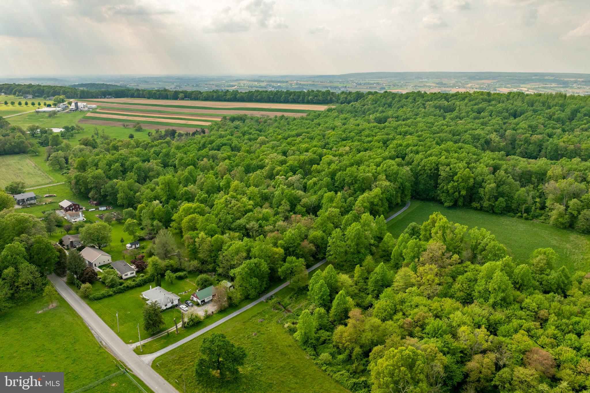 AUCTION DATE - WEDNESDAY, JULY 31, 2024 @ 5 P.M. LISTED PRICE IS AN OPENING BID ONLY AND IS NOT INDICATIVE OF THE FINAL SALE PRICE. REAL ESTATE: Custom 2½ story log/cedar siding house w/1854 SF finished area, large eat-in kitchen w/walk-in cooking fireplace, custom painted cabinets & Kitchen-Aid stainless-steel appliances, living room, office/den, 4 bedrooms, 2 baths, 1st floor laundry/mudroom w/washer & dryer included, full basement w/rec & storage rooms, propane forced air heat, central AC. Special Features: Exposed ceiling & wall beams, wide hardwood flooring, Colonial trim & panel doors thru out, Honda generator & 500-gallon propane tank. Outbuildings: Detached 1½ story wood frame/sided 2 car garage 28x23 w/overhead storage, utility shed 11x20 w/overhead door & utility shed 11x20 all on 20 ACRE wooded lot w/macadam driveway, peaceful setting, on-site well & septic. Enrolled in Clean & Green. NOTE: Owners downsizing to smaller quarters & motivated to sell! Ideally located clean & well-maintained one of a kind custom log house w/many original features in move-in condition. A must see to appreciate quality. Convenient location, minutes to Gap, Compass, White Horse & Parkesburg w/easy access to Rts. 10, 30 & 340. Terms 10% down, balance 60 days or before.