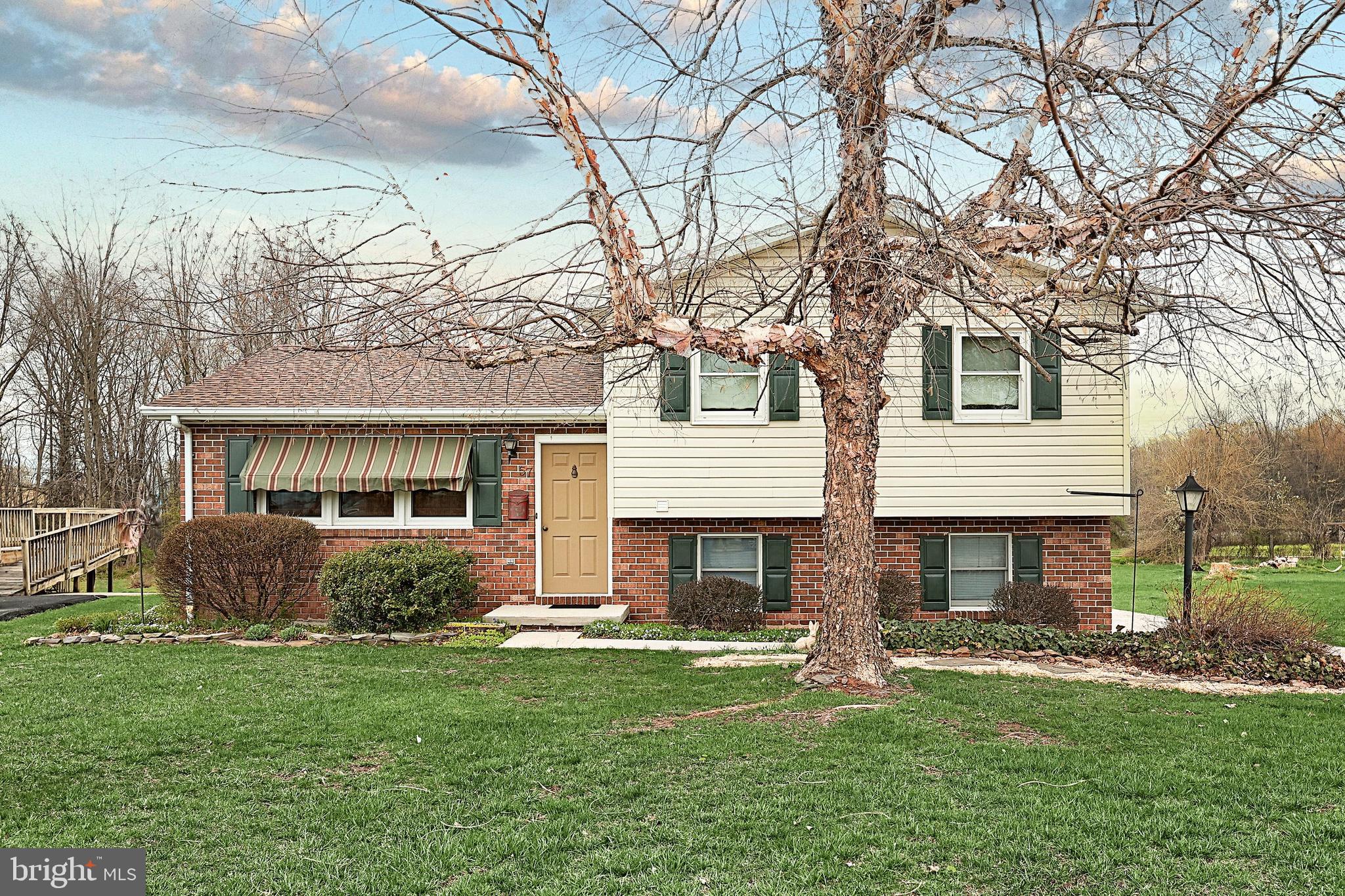 Very nice move in ready split level home with a 2 car garage sitting on almost a half acre.  4 levels containing 2 levels of finished living space, 1 level for storage or future expansion, and the4th level is the garage.  Sellers replaced the windows, carpets, and kept this home in great condition, and closed in the deck to create a beautiful sunroom.  All appliances stay. The spacious, rear load garage  has an opener, insulated overhead door, and a macadam driveway leading to it.  The yard has lots of room to play, has a firepit to enjoy your evenings, and a big shed.