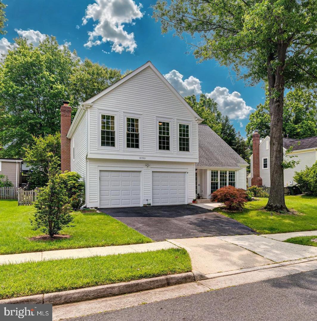 Welcome to 12333 Cliveden St, Herndon!  This bright and airy detached single-family home is full of natural light, thoughtful upgrades, and charm — and it's a commuter’s dream, perfectly situated between Reston and Sterling, just off Dranesville Road and minutes to Wiehle Ave and Dulles Airport (less than 10 miles!).  The sellers have lovingly maintained and upgraded the home over the years: Roof & siding replaced (2019) Water heater (2020) Full PVC plumbing update Kitchen renovation (2011) Garage & new garage doors (2021) Bathrooms & laundry remodels (2022) Subfloor repairs, LVP flooring, new bannisters, ceiling fans (2022) Backyard retaining walls, landscaping, and patio (2022) Light-Filled Living & Flowing Layout This home features 3 spacious bedrooms, 2.5 bathrooms, and vaulted ceilings throughout — giving every room an open, airy feel. Step onto sleek, 3-year-old LVP flooring and into the formal living room, where a charming bay window brings in beautiful morning light. Just beyond the formal living room is the formal dining room, surrounded by windows and perfect for hosting. The kitchen shines with natural light from skylights above, granite countertops, and gas cooking — ideal for preparing your favorite meals. Nearby, the breakfast nook offers cozy views of the private backyard and connects directly to the inviting living room with a gas fireplace. Conveniently located on the main level: Powder room, laundry room, garage access and a direct walk-out to your backyard oasis.  Backyard Bliss: Step outside to your private, shaded backyard retreat. Mature trees offer natural privacy, and the sellers are happy to leave the trampoline for new owners. Love to garden? You’ll enjoy two raised garden beds and fruiting pawpaw trees — a rare tropical-tasting fruit (think mango meets banana) that’s nearly impossible to find in stores. Upstairs Retreat: At the top of the stairs, you'll find a versatile loft space — ideal for a home office, playroom, or reading nook. Down the hall are two generously sized bedrooms, both featuring custom closet organizers. At the end of the hallway, the primary suite impresses with vaulted ceilings, a built-in reading light, and a luxuriously renovated en suite bathroom. Enjoy the spa-like finishes, and a walk-in closet located right inside the bath for convenience.  Don’t Miss This Opportunity! From its sun-drenched interior