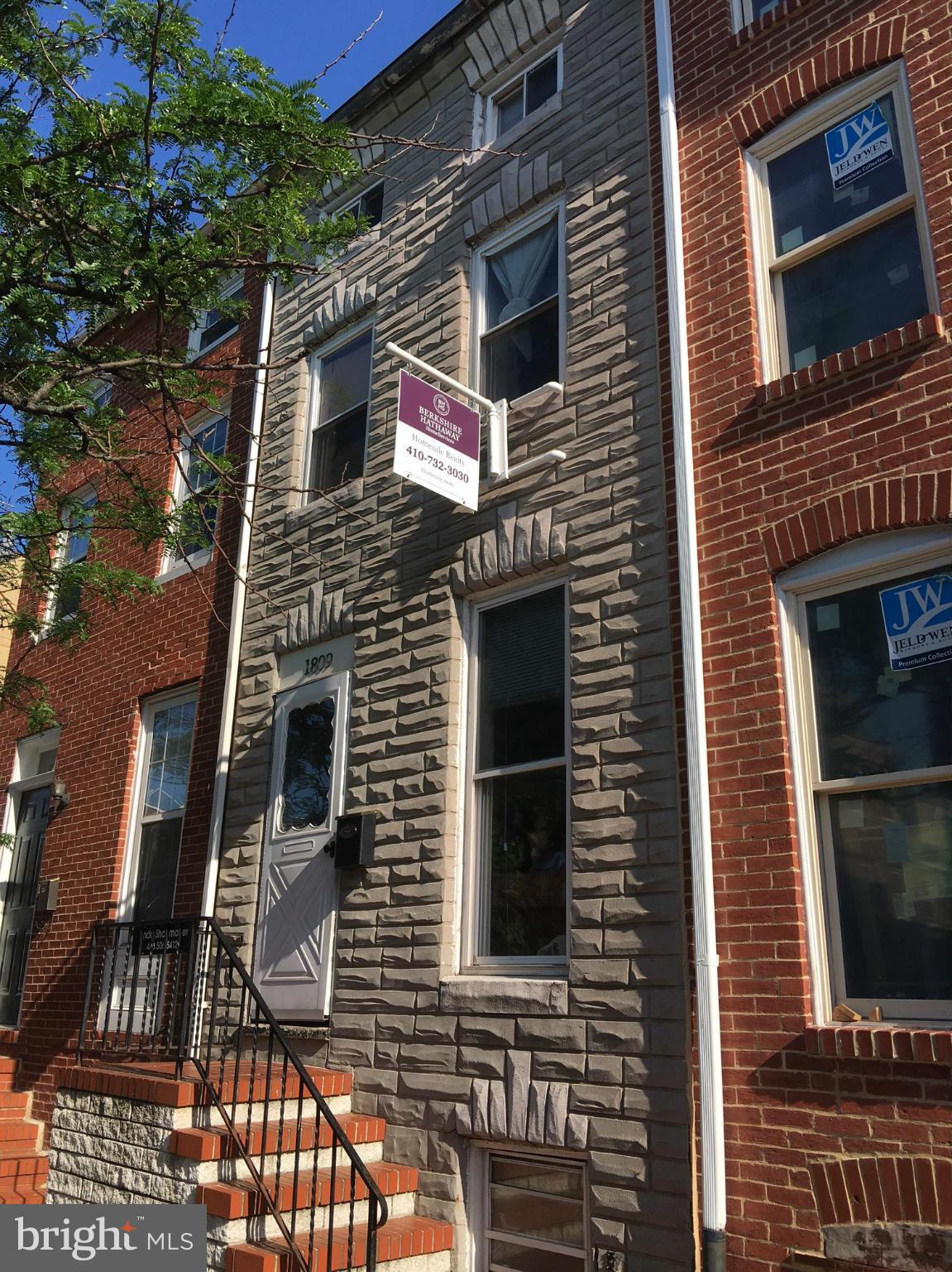 Brick townhouse features hardwood floors throughout, ceramic tile and stainless steel appliances  in kitchen.  Finished basement and finished 3rd floor loft.