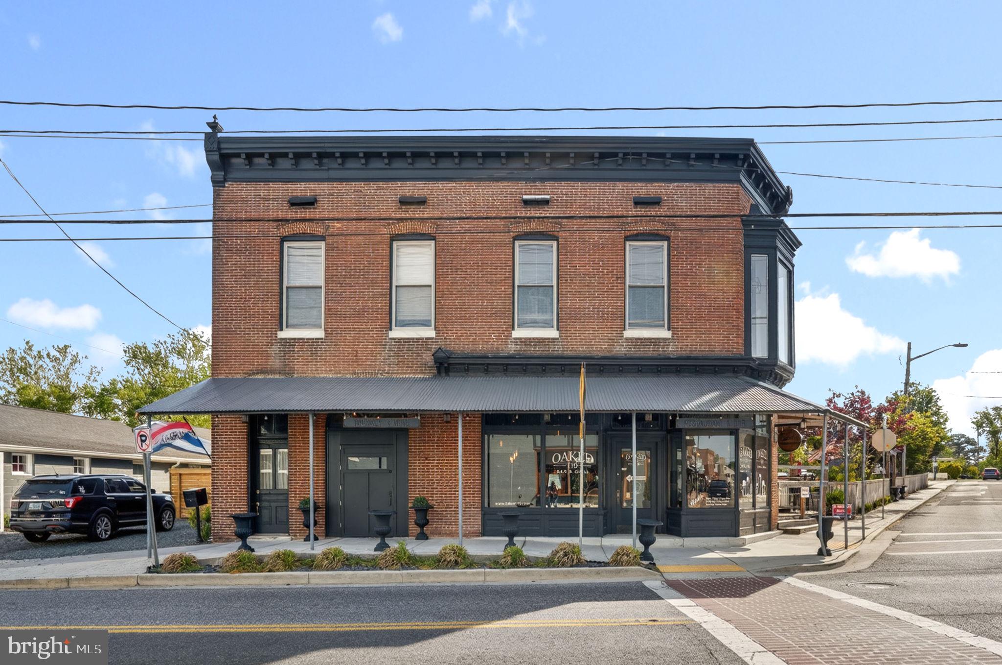 Exceptional opportunity to own a well-established restaurant and event venue located in the heart of historic Snow Hill. This downtown property offers over 3,000 sq ft on the main level featuring a very successful restaurant with 2 indoor bars, spacious dining areas, and a large outdoor gathering area with an outdoor bar perfect for entertainment and social gatherings. Ideally positioned near local county offices and county courts in a thriving downtown setting with strong visibility and steady local and visitor traffic. The second floor offers an additional 3,000+ sq ft including a banquet/event room, full commercial kitchen, office space, and potential apartment or living quarters. Fully equipped sale with furniture, fixtures, equipment, and contents conveying, making this a true turnkey opportunity. Endless possibilities for restaurant expansion, catering, events, nightlife, mixed-use development, and more. Conveniently located near the Pocomoke River and within easy access to Ocean City, Salisbury, local beaches, and NASA Wallops Flight Facility. Unique properties with this size, location, and flexibility rarely become available.