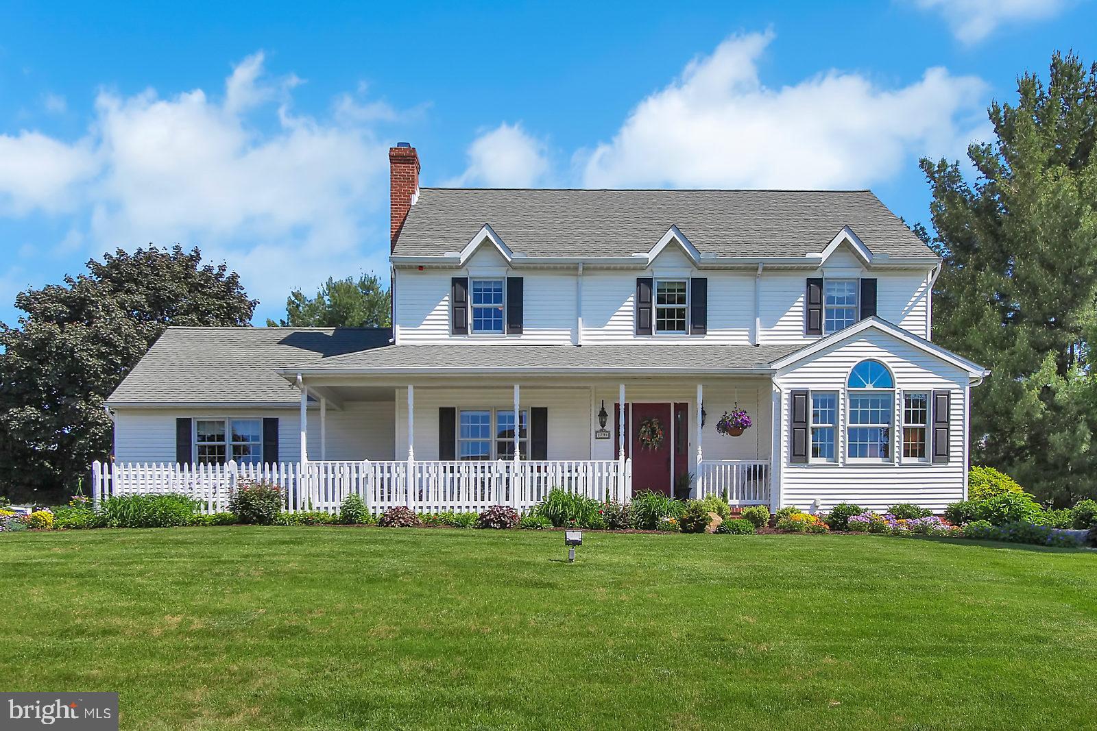 Gorgeous 2 Story Colonial located on a beautifully landscaped corner lot in the popular Chestnut Run neighborhood in the Dallastown School District. Upon entering this inviting home you will be greeted by a grand two-story foyer with a curved open staircase and lots of natural sunlight throughout. Bright & open 1st floor features a large family room with a brick gas or wood fireplace and custom crown moulding, breakfast nook with sliding doors leading to the rear deck, spacious kitchen with center island,  granite countertops and stainless steel appliances, separate dining room and large living room with custom crown moulding, chair rail and a unique cathedral ceiling. Relaxing master suite with a walk-in closet and remodeled luxury master bath with tile walk-in shower.  Lower level offers a rough-in bath and opportunity to finish for additional living space. Enjoy summer entertaining on the large private rear deck offering great views of the backyard with mature shade trees. Attached side-entry two car garage with storage. Newer roof, furnace, air conditioning, water heater, hardwood, tile, carpeting, powder room, appliances  & landscaping. This home has been meticulously cared for and is ideal for entertaining. Don't miss this opportunity.