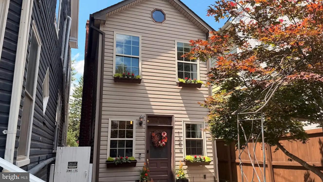 Tucked back from the road and unlike anything nearby, 124 Church St blends the charm of a Victorian cottage with thoughtful modern updates throughout. This working-class Victorian home offers character at every turn, including extra-tall ceilings, porthole windows, a refinished staircase, under-stair storage, and a front bedroom with a cathedral ceiling, original beams, an octagonal window, and a hidden storage room dating back to the 1800s. The home features 3 full bathrooms, including a renovated guest bath with updated tile, sink, and hardware. The kitchen has been refreshed and includes newer appliances, while vinyl wood-look flooring flows throughout most of the home. Smart and practical upgrades include Google Nest doorbell cameras, a Nest thermostat, smart locks, fiber internet, a new water softener, and a newer heat pump. Outside, enjoy a private backyard retreat surrounded by a newer 6-foot privacy fence. This area includes a new deck, a large covered entertainment area, raised perennial beds, two Japanese maples, window boxes, updated garden liner, and polymeric sand. A two-story shed with hayloft doors adds even more charm, storage, and flexibility. Full of history, warmth, and personality, this one-of-a-kind New Windsor home is ready to welcome its next owner.