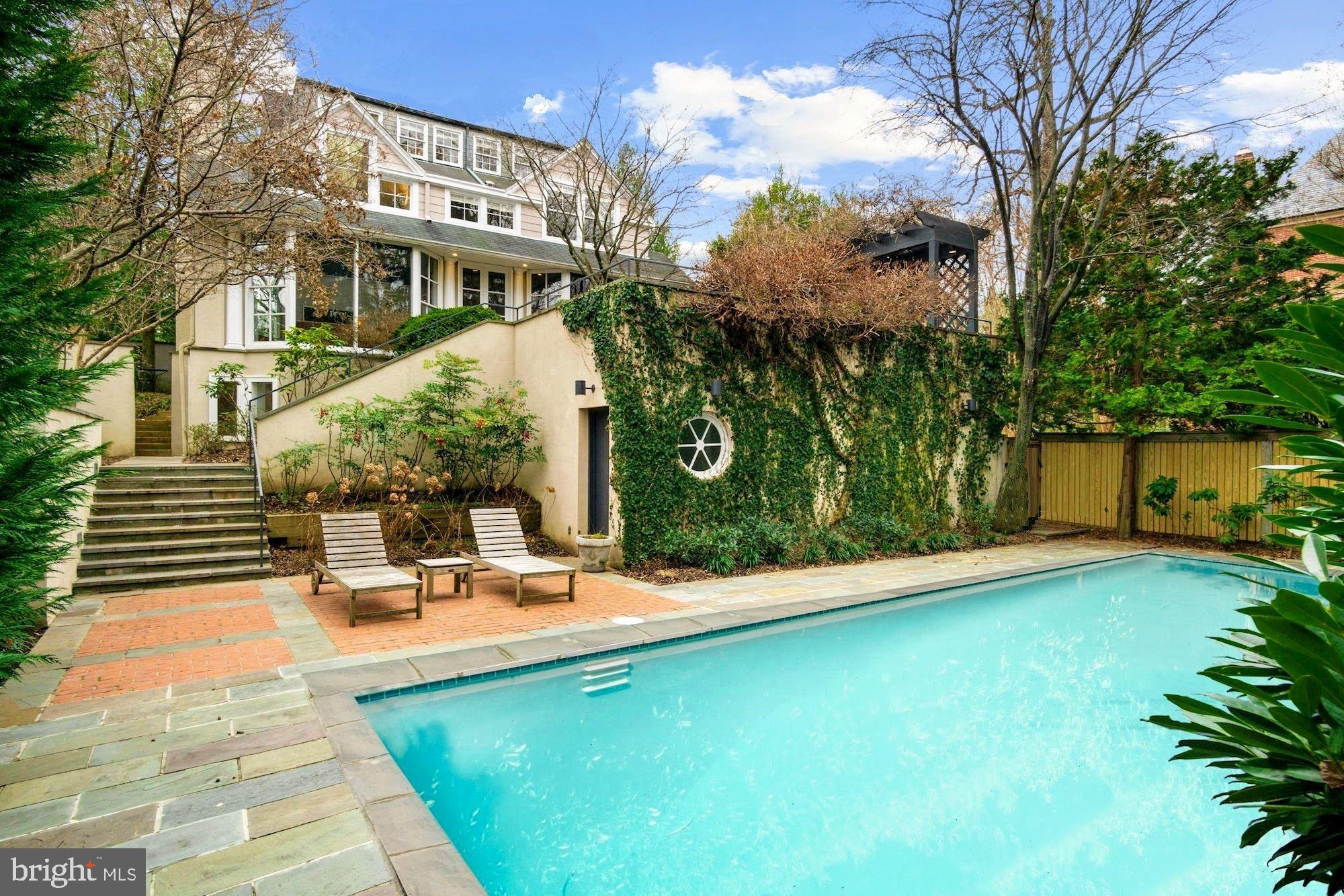 Elegant, understated mini-estate on a wonderful lot. This ideally located Wesley Heights home is full of character thanks to a complete designer renovation and expansion. Grand interior boasts 4-levels including substantial space for family and guests with 7 Bedrooms and 5.5 Bathrooms, 3 fireplaces, 2-car garage, and a brilliant entertaining floor plan with large scale rooms,  natural stone & stainless steel kitchen, and  family room addition offering floor-to-ceiling panoramic vistas to the incredible lush private gardens including extensive hardscaping with multi-level terraces, pergola, large swimming pool, fenced yard with tree house and more!  Perfect location just a stone's throw to neighborhood restaurants, and minutes to parks & trails, National Cathedral, Georgetown, The White House, and all of downtown DC. Must see to believe!