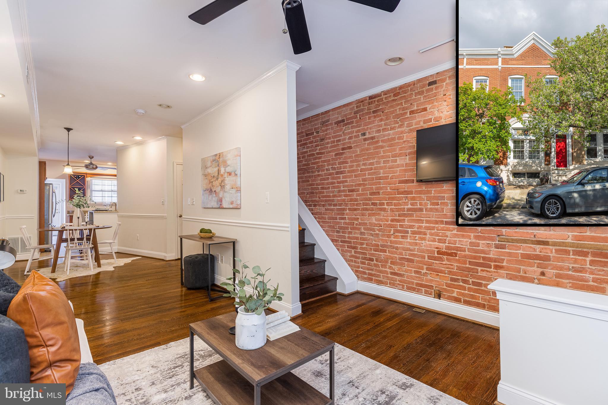 OFFER DEADLINE MONDAY 4/19 @ 5PM - STYLISH CANTON HOME W/ PARKING PAD ON TREE LINED STREET - conveniently nestled between Patterson Park and the Canton Square this large home features an open floor plan with hardwood floors throughout, exposed brick, crown molding, main level half bath and an updated eat-in kitchen with granite countertops, ss appliances and custom cabinetry leading to large oversized parking pad.  Upper level offers two bedroom suites, large closets, updated baths and hallway access to roof top deck!  Finished basement offers flex use as 3rd bedroom with fireplace and laundry room- great value at this price!