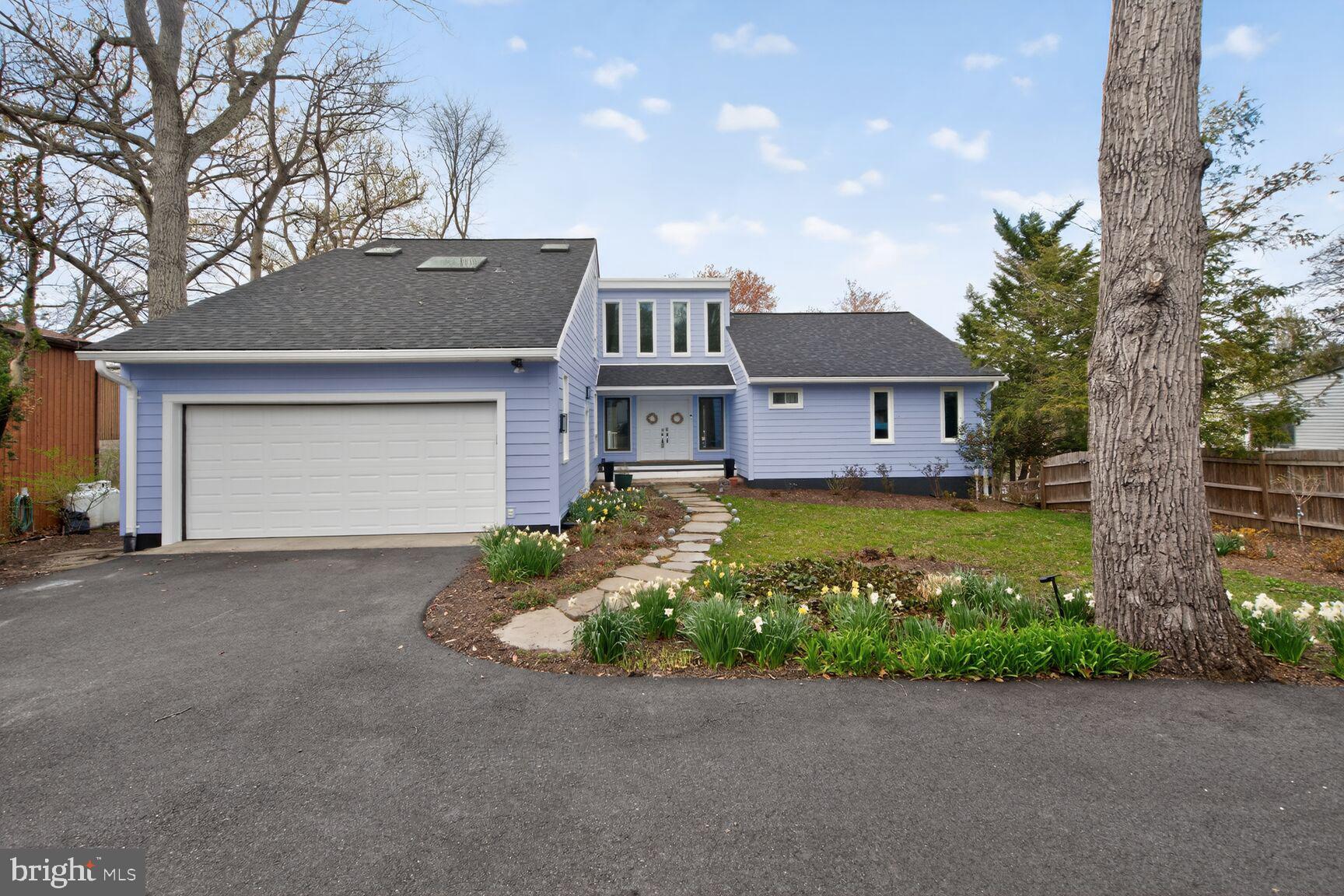 Welcome to an exceptional waterfront retreat offering truly breathtaking views. If you’ve been dreaming of a life on the water, this freshly painted 5‑bedroom, 3‑bath home, enhanced with brand‑new Hardie siding and high‑efficiency insulation (2025), is ready to welcome you. Step through the front door and immediately take in the stunning water views that define this home. The main level features a beautifully updated kitchen with premium stainless-steel appliances and elegant quartz countertops. Expansive new windows (2024) fill the dining room and spacious living room, complete with a cozy fireplace, and abundant natural light. New sliding glass doors (2024) open to a generous deck, perfect for morning coffee, family meals, or simply relaxing as the sunlight dances across the water. Three bedrooms and a full bathroom are also located on the main level, including a standout bedroom with its own sunroom, complete with skylights and a private slider to the deck. You may find yourselves debating who gets this special space. Upstairs, the primary suite offers comfort and privacy with a beautifully appointed en‑suite bathroom. The fully finished lower level adds even more versatility, featuring a large family room, a spacious bedroom, an office, a full bathroom, and a laundry room. Another large sliding glass door leads outside to a new hot tub (2024), a boat dock, a boatlift (2023), a waterfront retaining wall and boardwalk (2024) and new Kayak dock and rack. As an added bonus, the stand‑alone garage has been transformed into fully finished living space, complete with a movie‑theater‑style screen, ideal for entertainment or guest overflow. This is a rare opportunity to own a beautifully updated home with unmatched waterfront amenities. You won’t want to miss it.