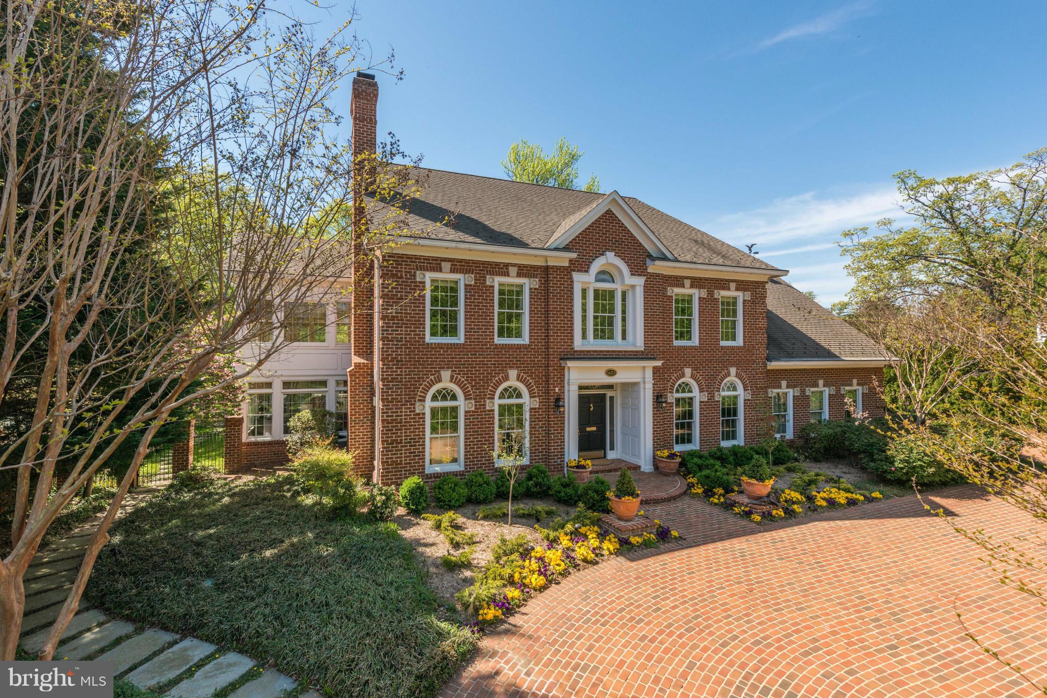 PRICE TO SELL!!  Looking for an offer! Stunning custom all brick colonial  highest quality throughout, 2 story foyer,elegant room sizes & special amenities including elevator, whole house generator, circular driveway & 4 car gar. Beautifully landscaped half acre lot with fenced back yard.Total of 4 bedrooms plus an au paire room and 4.5 baths and 4 fireplaces.Terrific location.