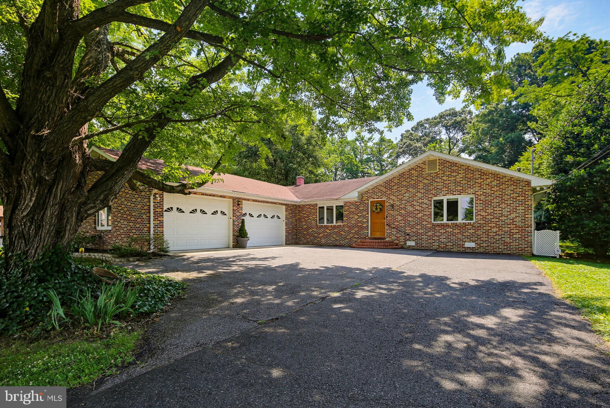 Welcome to 12815 Eastern Avenue! This beautifully maintained rancher is a thoughtfully updated 4-bedroom, 3.5-bath home situated on just under one acre in the desirable Twin River Oliver Beach area. Offering over 2,000 square feet of main-level living space plus a fully finished lower level, this home provides the perfect combination of comfort, functionality, and modern updates.

The spacious kitchen blends timeless craftsmanship with modern convenience, featuring original solid oak cabinetry, stainless steel appliances, brand-new quartz countertops, a matching quartz backsplash, and a large deep sink. Adjacent living and dining spaces create an ideal layout for both everyday living and entertaining. The inviting main living area is warmed by a cozy pellet stove, adding both charm and comfort during cooler months.

The main level includes three generously sized bedrooms, two and a half updated bathrooms, a convenient laundry/mud room with a modern washer and dryer, and a wet bar complete with a wine refrigerator and mini fridge. The primary suite features a spacious living area with a walk-in closet and a private, luxurious bathing space, complete with a large soaking tub, a walk-in shower, and heated floors. The remaining two bedrooms are also accompanied by a full bath with a jacuzzi tub combo.

The fully finished lower level offers exceptional flexibility, featuring a large kitchenette, spacious living area, fourth bedroom, and a brand-new, modern full bathroom. This space is ideal for guests, extended family, or a private recreation area.

Additional highlights include an oversized 825-square-foot attached two-bay garage, dual HVAC systems, and dual water heaters, with one HVAC unit and one water heater recently replaced. The well-maintained outdoor space is equipped with built-in propane lines for your grill and outdoor cooking space. A large fenced backyard provides ample space for outdoor activities, pets, gardening, and entertaining. The well-

Outdoor enthusiasts will appreciate the nearby public boat ramp access at Dundee Creek. With no HOA fees or restrictions, there is plenty of room to store a boat, trailer, RV, or other recreational equipment right on the property.

This home is truly move-in ready and offers additional peace of mind through recent system upgrades and updated maintenance contracts. Combining modern conveniences, generous living space, and the freedom of no HOA, this exceptional property is ready for its next owner.

Schedule your private showing today and discover all this wonderful home has to offer.