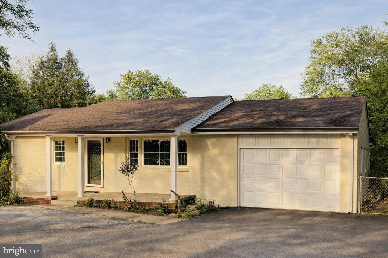 Welcome home to this thoughtfully renovated ranch-style property, refreshed in 2024 and set on a spacious 0.73-acre lot. The classic brick and vinyl exterior creates a warm, inviting feel, complemented by peaceful outdoor surroundings. Inside, the home offers a comfortable living space, including four bedrooms and two full baths. The open living area is bright and airy, and the updated kitchen is perfect for everyday cooking or sharing meals with friends. A partially finished basement with walkout access provides extra room to spread out. With both an attached and detached garage, plus a wide asphalt driveway, the property offers plenty of storage and convenience. The expansive yard invites you to enjoy the outdoors—whether relaxing, gardening, or creating your own gathering space. This home brings together comfort, style, and room to grow in a setting that feels welcoming from the moment you arrive.