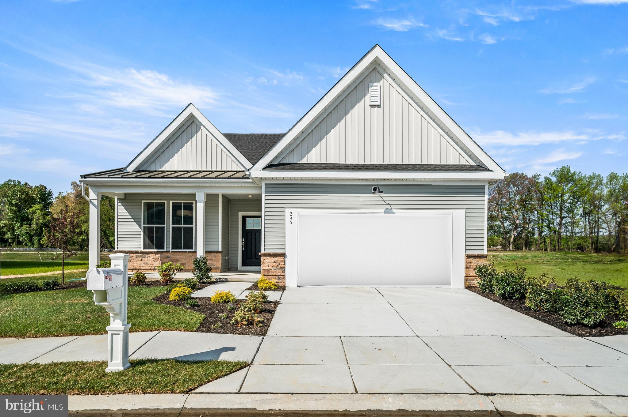 ***MOVE-IN READY!!* New construction home without the typical new construction wait time. Your new home invites you into the extra-wide foyer that leads to a versatile front flex room—ideal as a home office, den, formal living room, or dining space to suit your lifestyle. The heart of the home is the expansive great room, anchored by a well-appointed kitchen featuring a large island, walk-in pantry, and elegant 42" cabinets with crown molding. A casual dining area connects seamlessly to your covered patio, creating a wonderful space for indoor/outdoor living and entertaining. The great room is both spacious and cozy, with wooded views flanking the fireplace, adding natural beauty and warmth. Just beyond, the primary suite continues the peaceful theme with more scenic views, two closets, and a private en suite bath. This smartly designed home also offers a second bedroom and full hall bath, convenient laundry area with washer and dryer included, and a two-car garage with additional overhead storage—perfect for seasonal items and keepsakes. This is low-maintenance, high-comfort living at a price that’s hard to beat—don’t miss your chance to call this exceptional home yours!

Enjoy resort-style amenities and a full calendar of activities curated by an award-winning lifestyle director who knows how to keep things fun and fresh. From relaxing afternoons by the pool to lively evenings in the community ballroom, every day brings new ways to connect and thrive.

Highlights include: Resort-style swimming pool with Olympic lane, fitness and wellness center, Outdoor kitchen and covered veranda, Bocce, putting green, community gardens, Game room, poker table, billiards, and more!

Schedule your private tour today and see how easy—and exciting—life can be at Noble’s Pond.

*Pictures of are model home and for representational purposes only. Please see New Home Consultant for details. Taxes to be assessed after settlement. If using a Realtor: the agent's client must acknowledge on their first interaction with Lennar that they are being represented by a Realtor, and the Realtor must accompany their client on their first visit.  Visit 233 Cosmos Ln model home for access and open houses.*