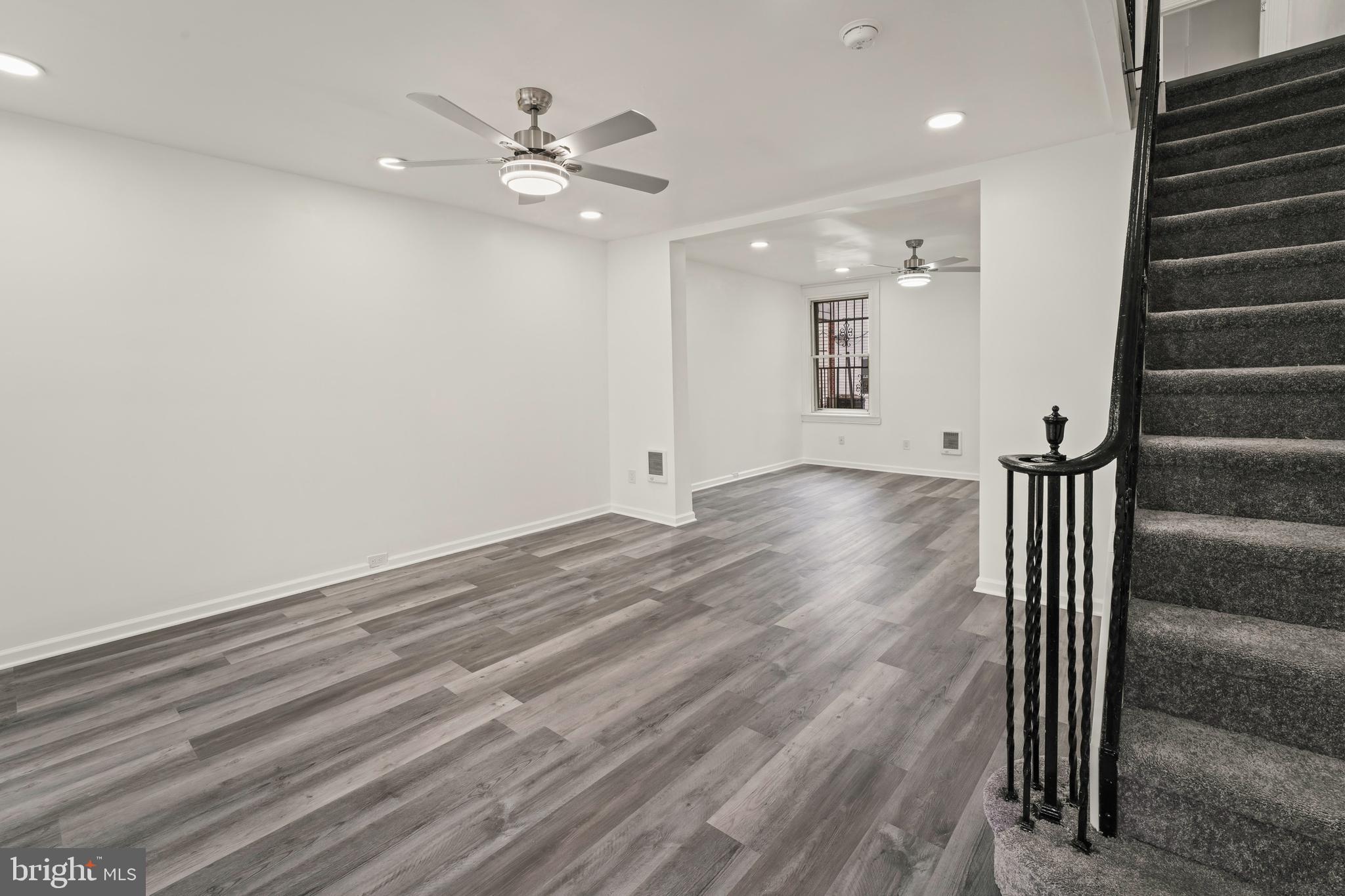 Fully Renovated 4-Bedroom Rowhome in Southwest Philadelphia! Welcome to your beautifully renovated urban oasis in the heart of Southwest Philadelphia! This stunning 4-bedroom, 2-full bathroom rowhome seamlessly blends modern comfort with historic charm. From top to bottom, no detail has been overlooked in this thoughtfully updated residence.  Step into a bright and airy living space adorned with modern finishes, remote-controlled modern ceiling fans, recessed lighting (with 2 colors!), new LVP throughout, newly carpeted stairs, freshly painted walls, and new windows and doors, creating a welcoming atmosphere throughout. The heart of the home is the brand-new kitchen featuring stainless steel appliances and stylish cabinetry. Whether you're a culinary enthusiast or enjoy casual family meals, this kitchen is sure to impress.   Four generously sized bedrooms provide ample space for a growing family or the perfect opportunity for a home office or guest room. Each room boasts plenty of natural light, closet space, and newly installed flooring.  Indulge in the comfort of two fully renovated bathrooms featuring modern fixtures, sleek tile work, and spa-like finishes. The perfect retreat after a long day.  The thoughtfully designed floor plan maximizes space and functionality, offering a seamless flow between the living, dining, and kitchen areas.   The basement is built out that you could convert to a 1 bedroom apartment if you choose.  Benefit from peace of mind with updated electrical, plumbing, and heating systems. A very unique feature is that each room has individual wall heaters with their own thermostat.  No more complaints that it is too hot or too cold for anyone.  This home is move-in ready with all the modern conveniences.  Situated in a vibrant neighborhood, this rowhome is just moments away from local shops, restaurants, public transportation, and parks. Experience the best of city living with all the amenities at your doorstep.  This fully renovated rowhome presents a rare opportunity to own a piece of Southwest Philadelphia's history with all the modern luxuries. Schedule a showing today and envision the lifestyle that awaits you in this stylish and turnkey residence!