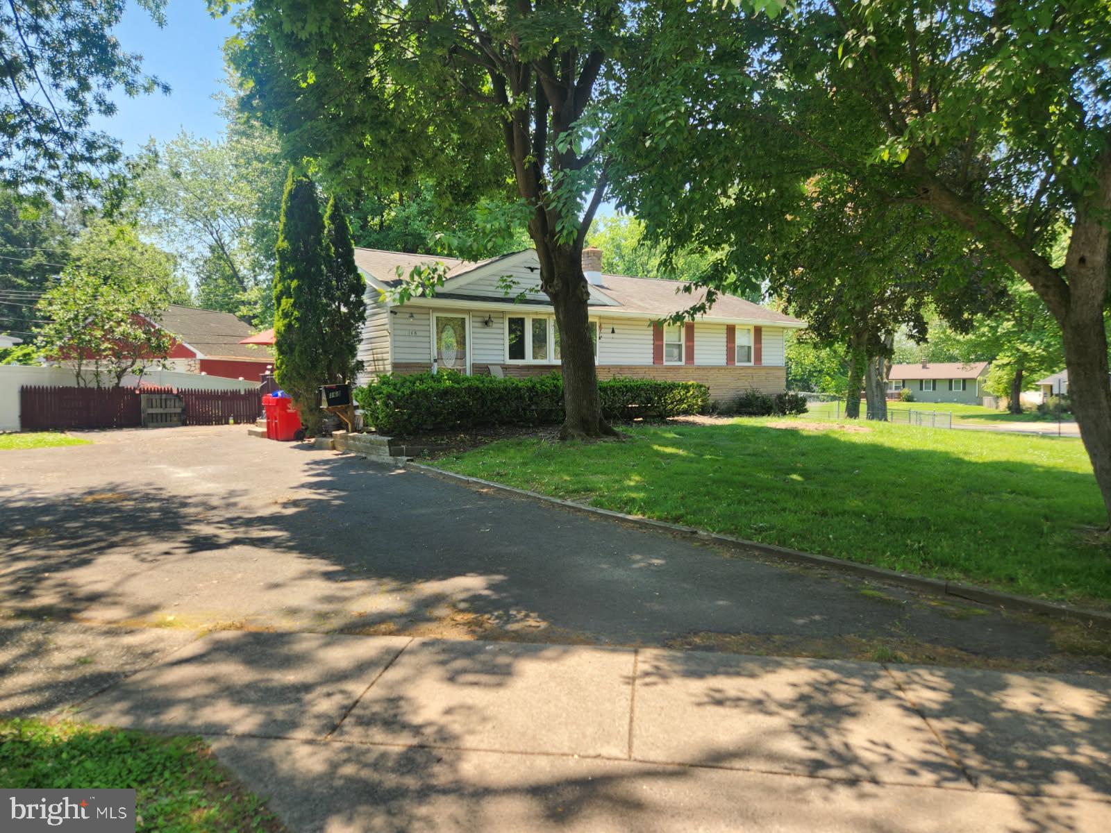 Half Brick front Rancher on a corner lot with large open driveway  with parking to accommodate  6 cars. Rear fenced yard with side entrance to kitchen and wood deck. Front entry opens to vaulted ceiling in the living room with large Bay casement window. Eat in kitchen off the Living room features solid raised cabinetry Built in dishwasher ,Gas range with microwave above. 3 bedrooms with ample closet space, Hall bath with tub shower surround Large unfinished basement with 9' height and outside exit, newer gas furnace and central air.Nice corner lot! PV fenced  backyard.