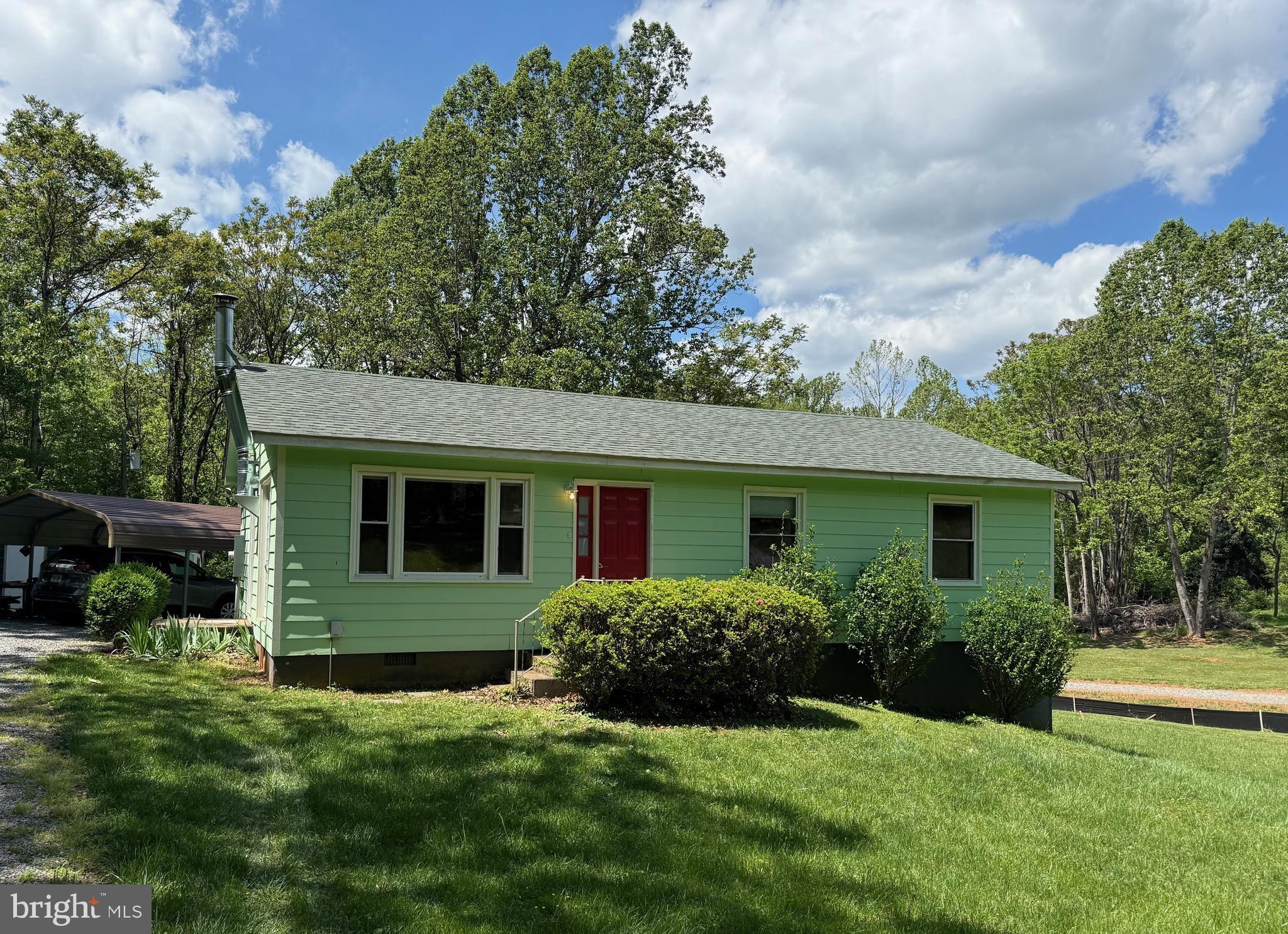 Somerset is located in the foothills of the Blue Ridge Mountains and this lovely rancher nestled on a .92 acre lot with wooded views is less than 1 mile from The Market at Grelen, a European Garden Shop set on Grelen Nursery's 1000-acre tree farm.  This 3 bedroom, 1.5 bath, 1008 sf home boasts a new architecural shingled roof, new Lennox Elite Heat Pump, two Stiebel Eltron tankless on demand water heaters, new stainless electric range and built-in microwave.  Mature oak and tulip trees provide abundant shade to your yard.  New construction home to the right is 1200 sf and is selling for $350,000.

Extras include:  Detached garage, carport, 10' x 12' deck, 2 large sheds, stackable washer & dryer, dual pane vinyl windows, partial house gasoline generator, wood burning stove in the family room, under cabinet lights, fresh paint and new carpet.  Work bench and water softener system in walk-in crawl space convey.

Seller would be interested in selling the riding lawnmower and trailer.