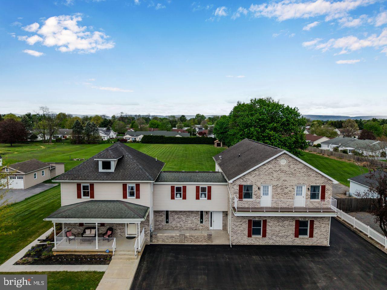Welcome to a rare opportunity to own a spacious and versatile home in highly desirable Silver Spring Township and Cumberland Valley School District. Situated on a level 1.41-acre lot, this expansive 6,460-square-foot property offers the size, flexibility, and functionality that are increasingly difficult to find. Designed with multigenerational living and in home occupation in mind, the home features 7 bedrooms, 7 bathrooms, 2 kitchens, 2 dining rooms, multiple family rooms, flex spaces, and bonus rooms to accommodate a wide range of living arrangements. In 2002, approximately 3,800 square feet was added to the existing home, significantly expanding its living space and possibilities. Previously, the seller operated a state-approved daycare from the home, complete with its own separate entrance and dedicated bathroom, adding even more potential for future permitted business or professional use. Outdoor amenities include a welcoming front porch, 3 generously sized private decks, 2 balconies, a patio, and parking for up to 12 vehicles. Whether you need room for extended household living, remote work, hobbies, or a permitted home-based business, this property offers exceptional adaptability. Located just minutes from shopping, dining, parks, and major commuter routes, this property combines the convenience buyers want with the space and setting they rarely find. Homes offering this level of square footage, acreage, parking, and flexibility in this location are uncommon. Schedule your private showing and discover the possibilities this one-of-a-kind property has to offer.