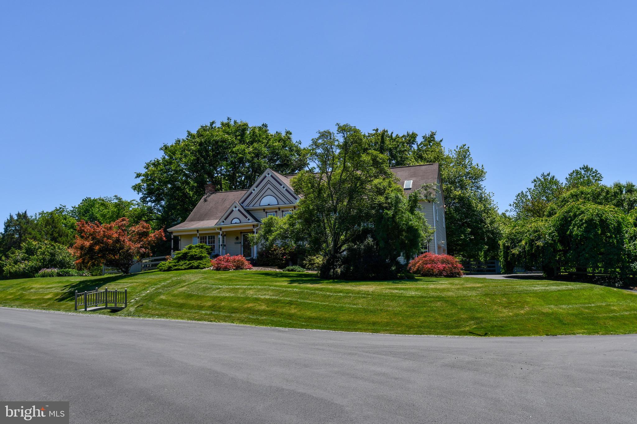 <p>Welcome to 11061 Tottenham Lane — part of the Langley school pyramid and endlessly desirable thanks to its rural feel, proximity to everything you need, and minimal HOA restrictions. Situated on a 0.69-acre lot, the home is surrounded by mature, flowering trees and smart landscaping that feels private without feeling remote.</p>

<p>This house grew with the sellers' family. A 1989 addition introduced a two-story footprint featuring a large primary bedroom with cathedral ceilings, a huge walk-in closet, and a spacious bathroom. Downstairs, the oversized 500 square foot garage comfortably fits two full-size vehicles.</p>

<p>In 2012, a second two-story addition brought a 450 square foot sunroom off the kitchen — bathed in natural light from 10 windows and four skylights — and a large home office below with ample shelving, two windows, and a private entrance. Walk out the sunroom's French doors to a Trex deck nestled in the trees, overlooking a cedar-fenced backyard. A 150 square foot storage room sits adjacent to the office. The primary bathroom was also fully reconfigured at this time: enclosed glass shower, jetted tub, stone sinks, and ample storage.</p>

<p>Most recently, the kitchen was refreshed with quartz countertops, an under-mount sink, and updated hardware throughout. Fresh paint completes the picture.</p>

<p>While the mailing address is Reston, the home is not part of the Reston HOA. The septic system is rated for three bedrooms and has served the current family of five without issue; Fairfax County has confirmed it can be enlarged if needed.</p>

<p>11061 Tottenham Lane is the total package — captivating curb appeal, smart additions, generous living space, and a community worth staying in. Schedule your showing today.</p>