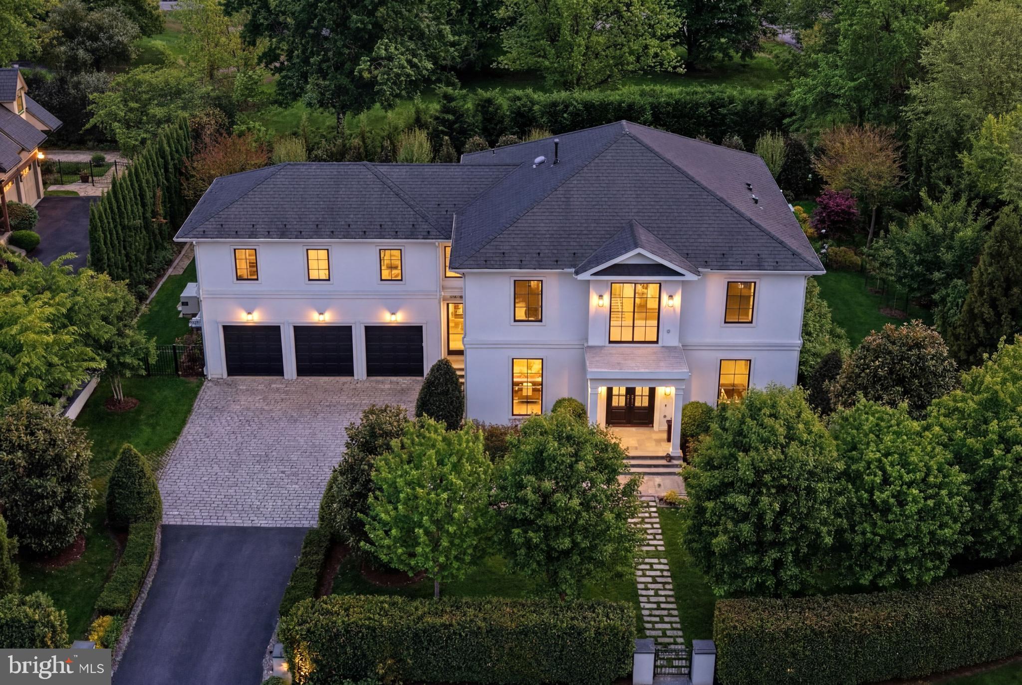 Just minutes from Washington, DC, this stunning McLean estate presents a modern interpretation of classical architecture with exceptional craftsmanship throughout. Newly built in 2018, the light-filled interiors offer a seamless flow from formal spaces to an open-concept kitchen, breakfast room, and living room overlooking private rear gardens and a swimming pool.  The south facing rear garden exposure allows the entire back of the house to be flooded with sunlight!    

The chef’s kitchen features custom European cabinetry and professional-grade appliances, while the primary suite provides a serene retreat with a newly renovated bath, heated floors, and dressing room with dedicated washer/dryer. Outdoor amenities include walkout level patios, a screened porch with retractable screen, and a saltwater pool. The house also includes a Whole-House Generator. 

The reimagined lower level is permitted as a separate Accessory Living Unit (ALU) with a second kitchen, bedroom, full bath, additional powder room, and flexible living spaces. An elevator services all levels, complemented by an oversized three-car garage and a prime location close to downtown McLean.