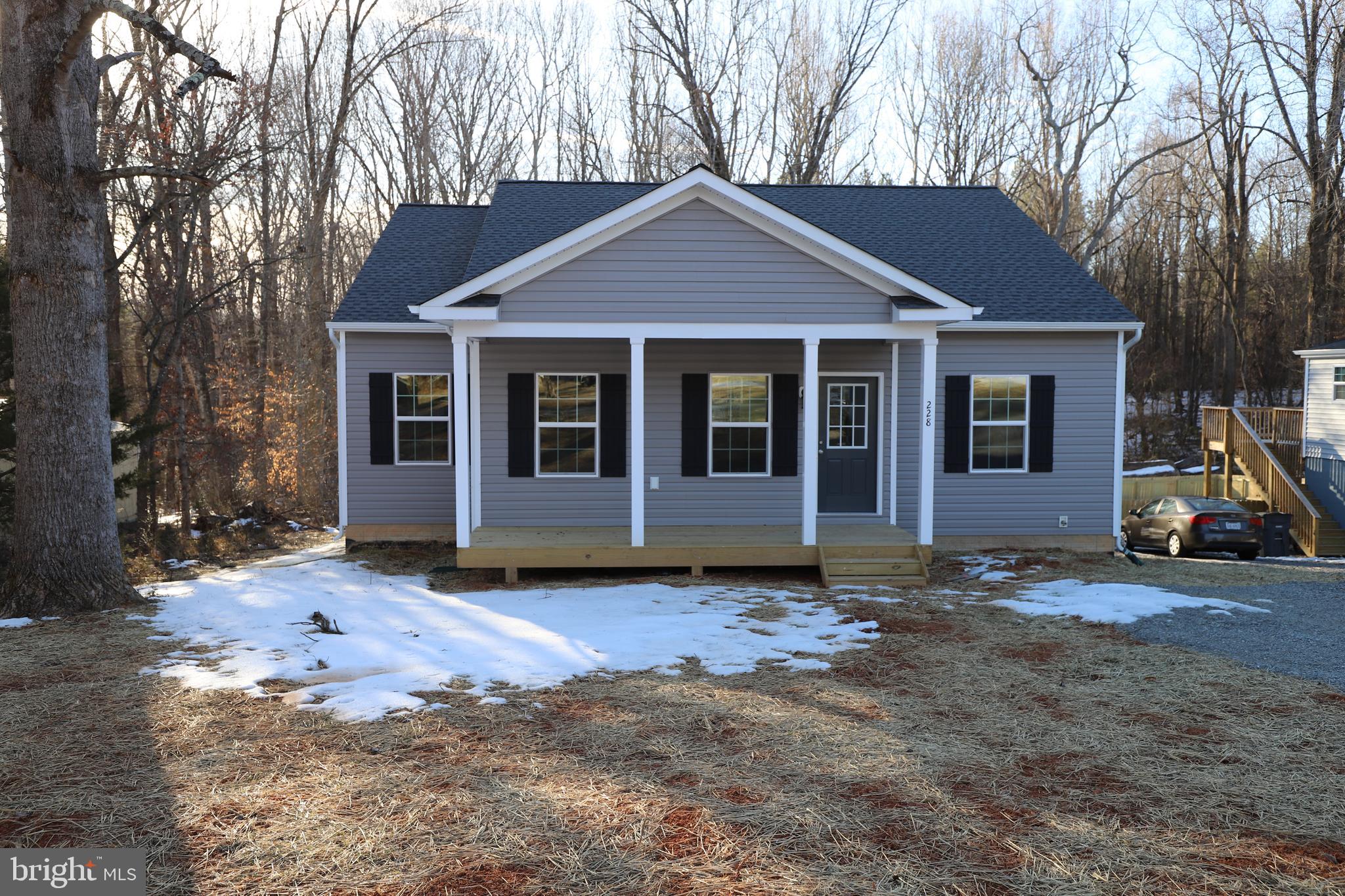 Newly completed and ready to move in! This is a very well constructed 3 bedroom 2 bath home with high-end finishes. Home features granite counter tops, LVP flooring, great appliances, spacious primary bedroom with a walk in closet, dual sinks and walk-in shower. Covered front porch and a 10 X 12 rear deck will be added shortly. You will love being walking distance from the beach, tennis courts and boat-landing. Have some fun......live in a Lake Community!