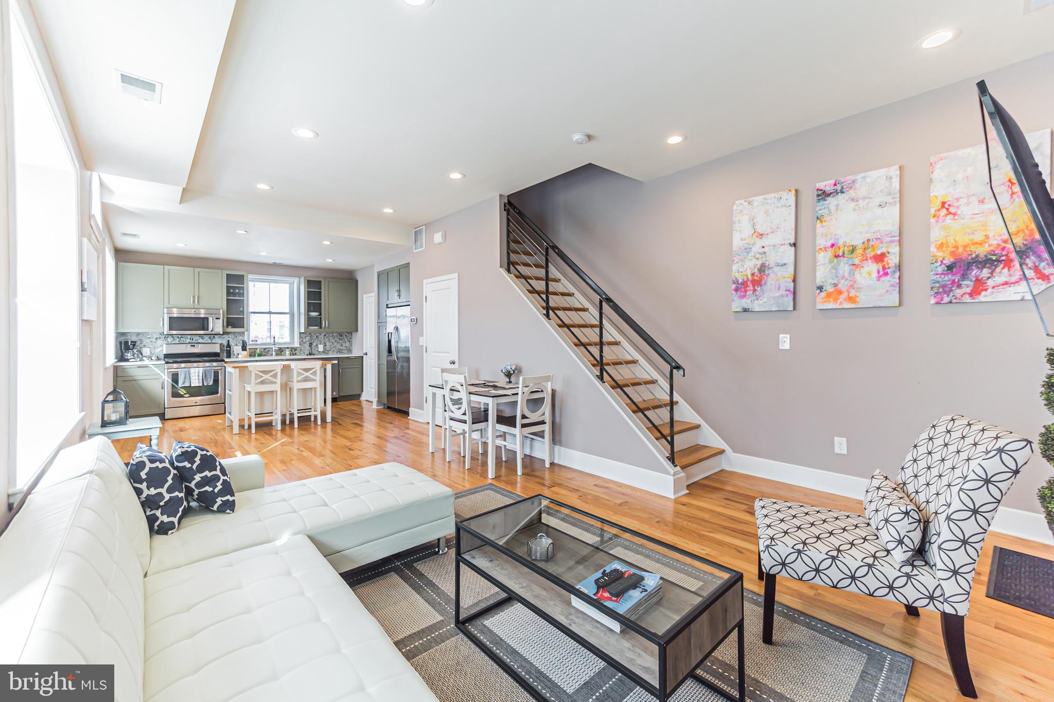 Welcome to 815 S 21st Street! This large corner townhome with one-car GARAGE PARKING in beautiful Graduate Hospital offers a roof deck with a fire pit, a walk score of 95, and abundant natural light, all within a 5-minute walk to two grocery stores, the Schuylkill River Trail, Fitler Square, Rittenhouse Square, and all the restaurants and shops. The first floor boasts a spacious, open living room, a half-bathroom, and a modern eat-in kitchen as well as access to the garage.  Up the stairs is the primary bedroom with an en-suite bathroom, ample closet space, and storage. A second bedroom is down the hall with a full bathroom in the hallway. Also on the second floor is access to the sunny roof deck; perfect for grilling or morning coffee. Offered furnished or unfurnished.